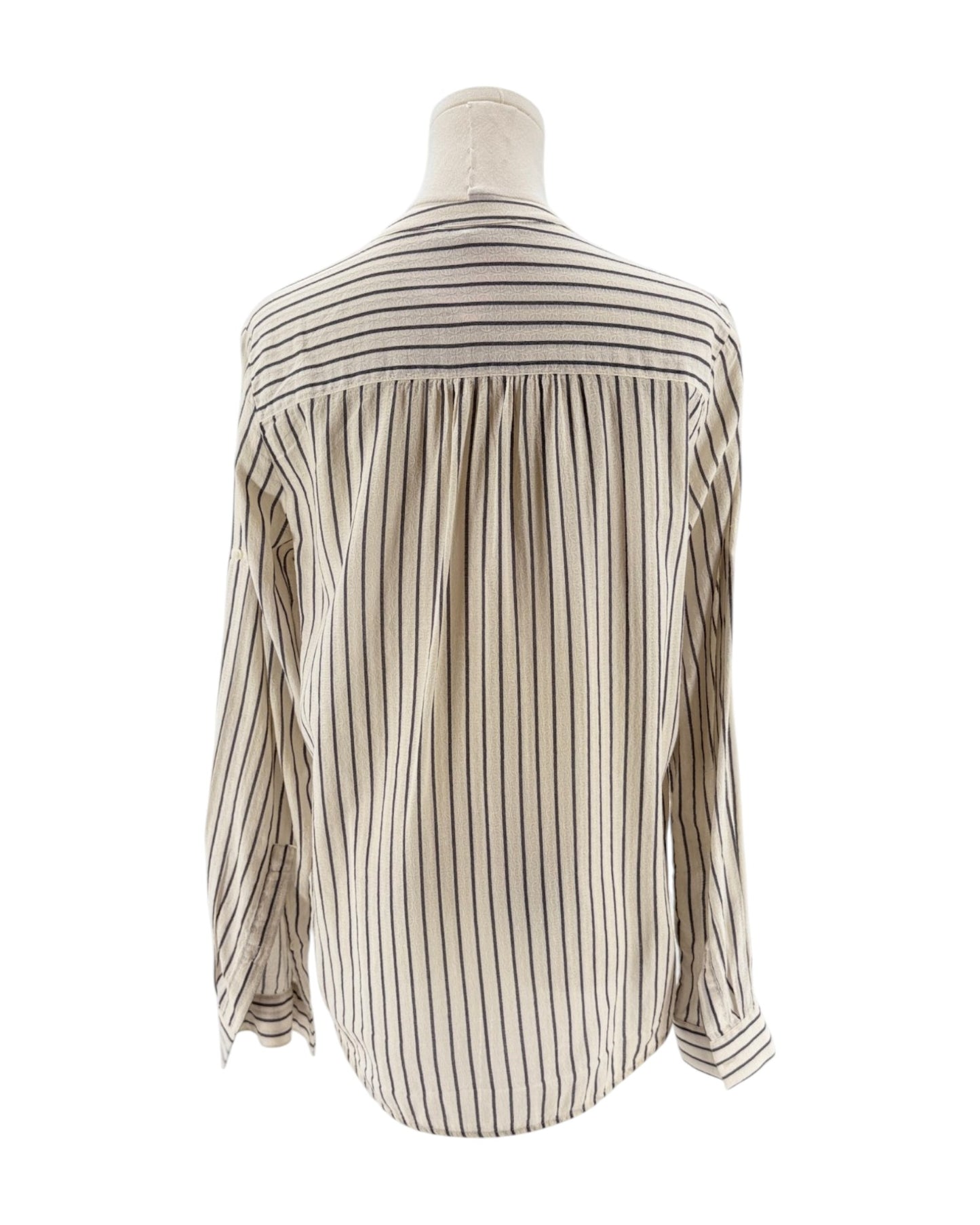 Striped shirt on a mannequin against a white background