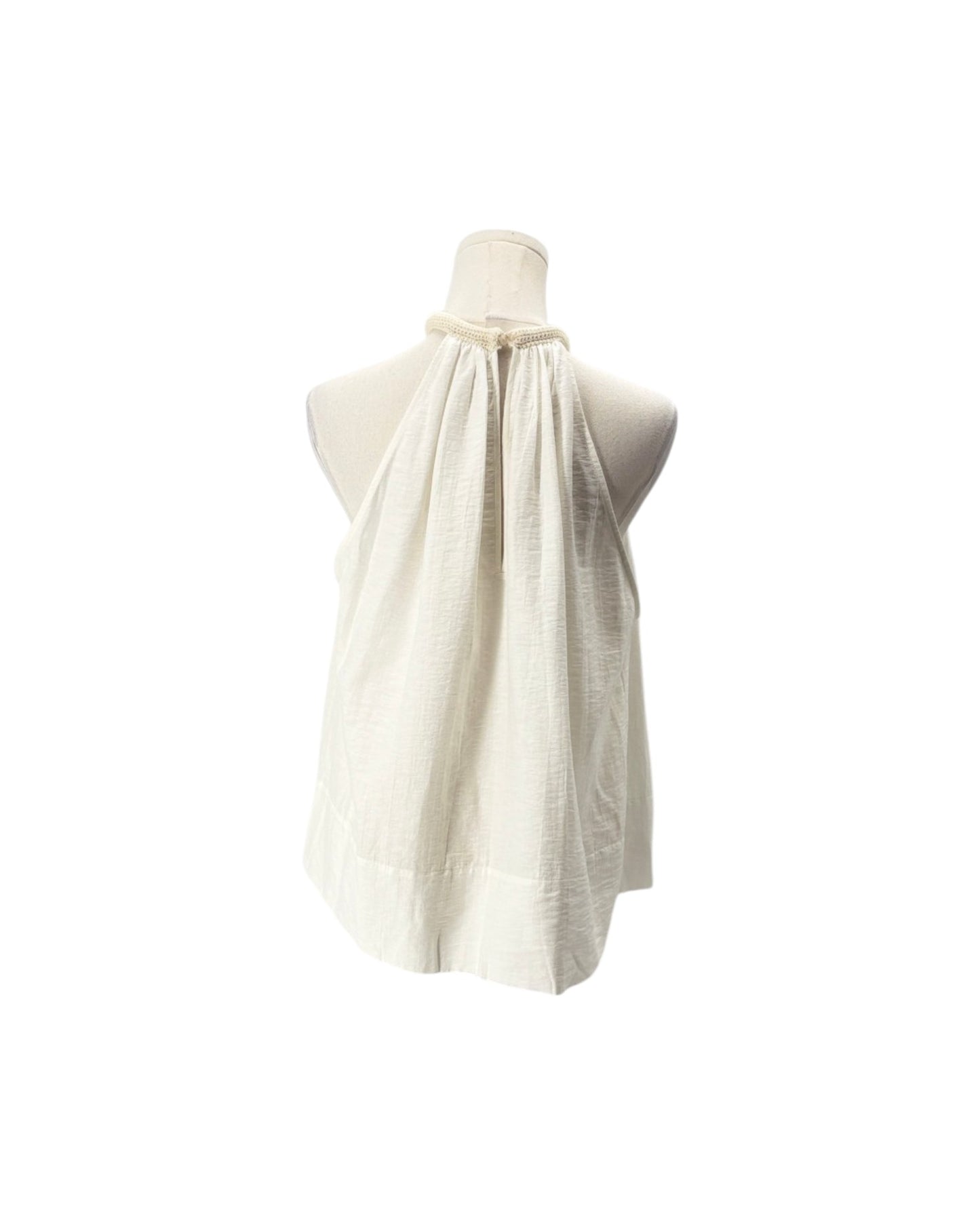 An off-white halter-neck top made of textured, crinkled fabric, displayed on a cream mannequin torso against a solid white background.