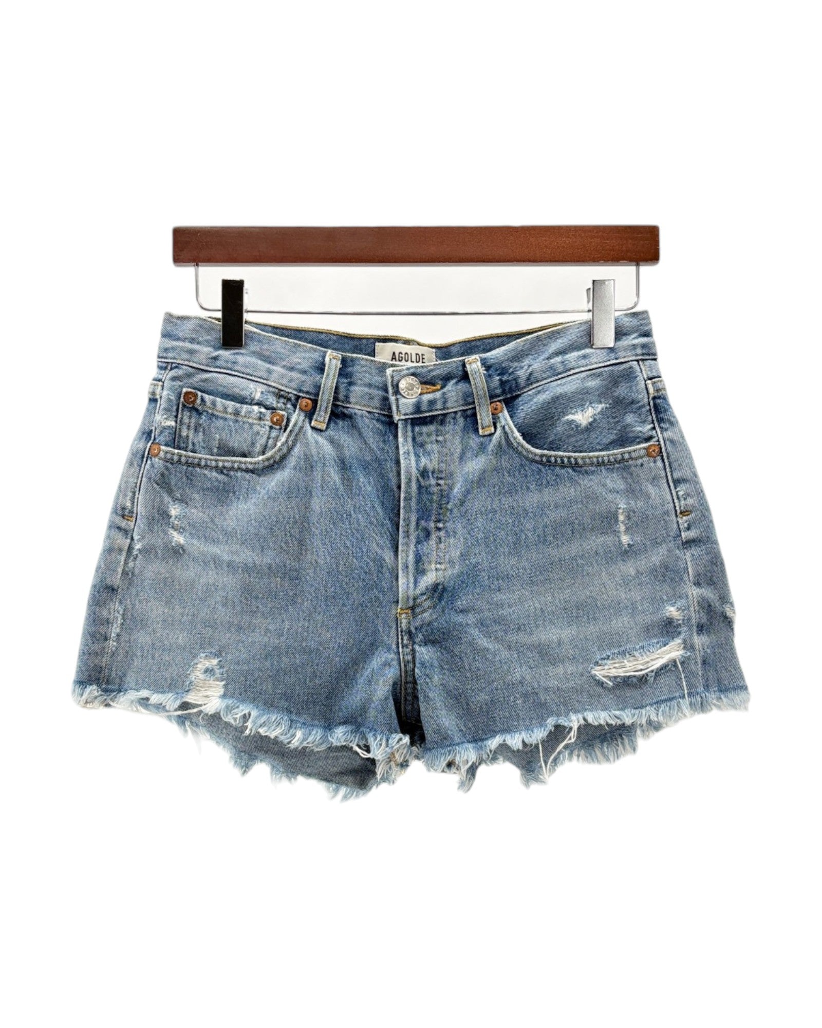 Denim shorts on a hanger with a white background