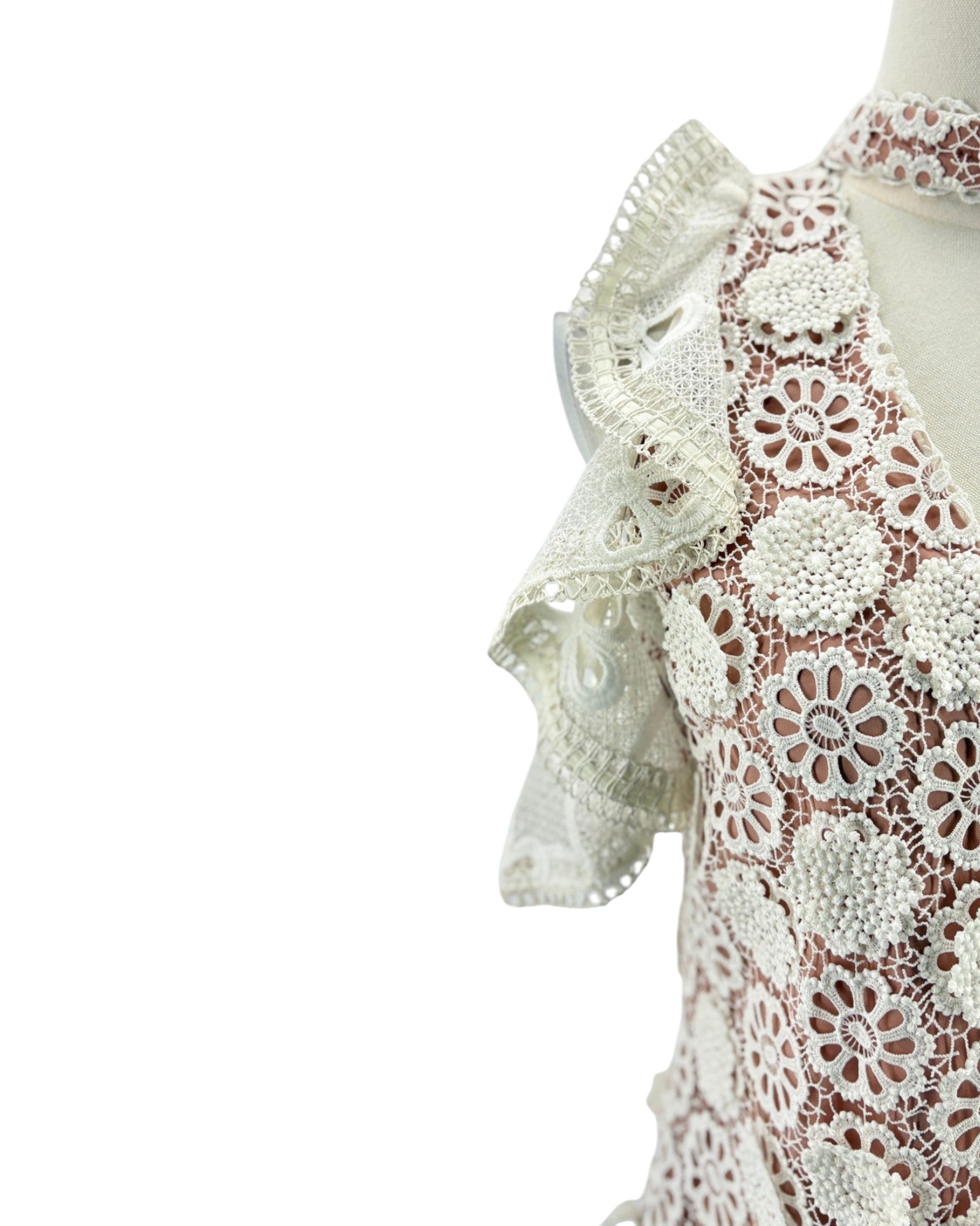 Lace v neck short sleeve blouse on a mannequin on a white background