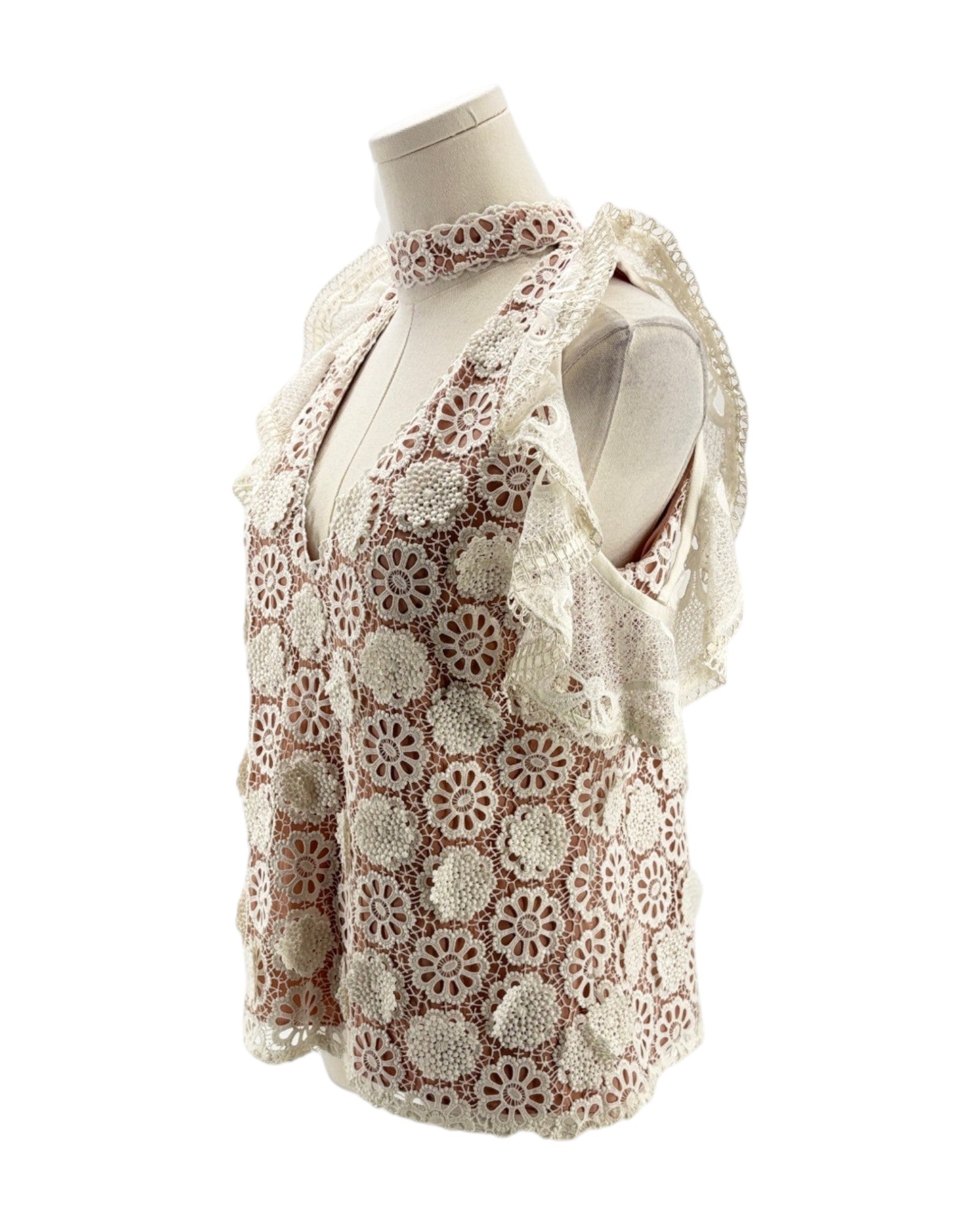 Lace v neck short sleeve blouse on a mannequin on a white background