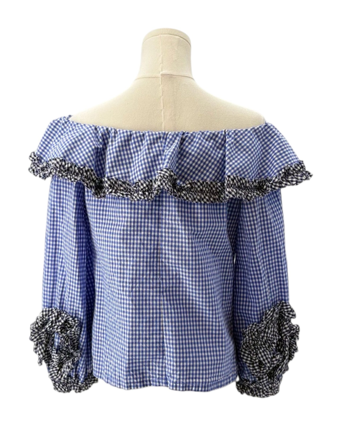 Alexis blue checkered gingham off-shoulder top with decorative sleeves on a mannequin against a white background