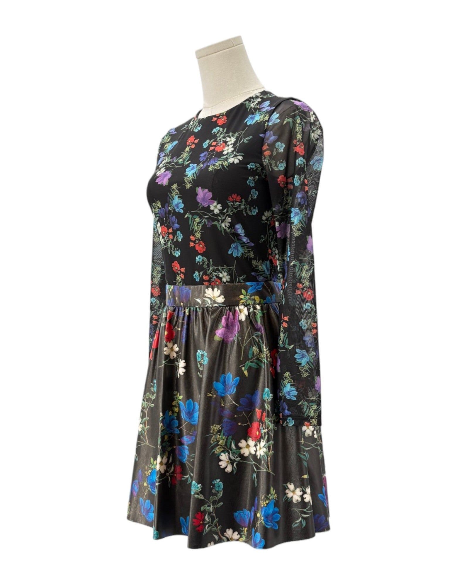 Floral dress on a mannequin against a white background