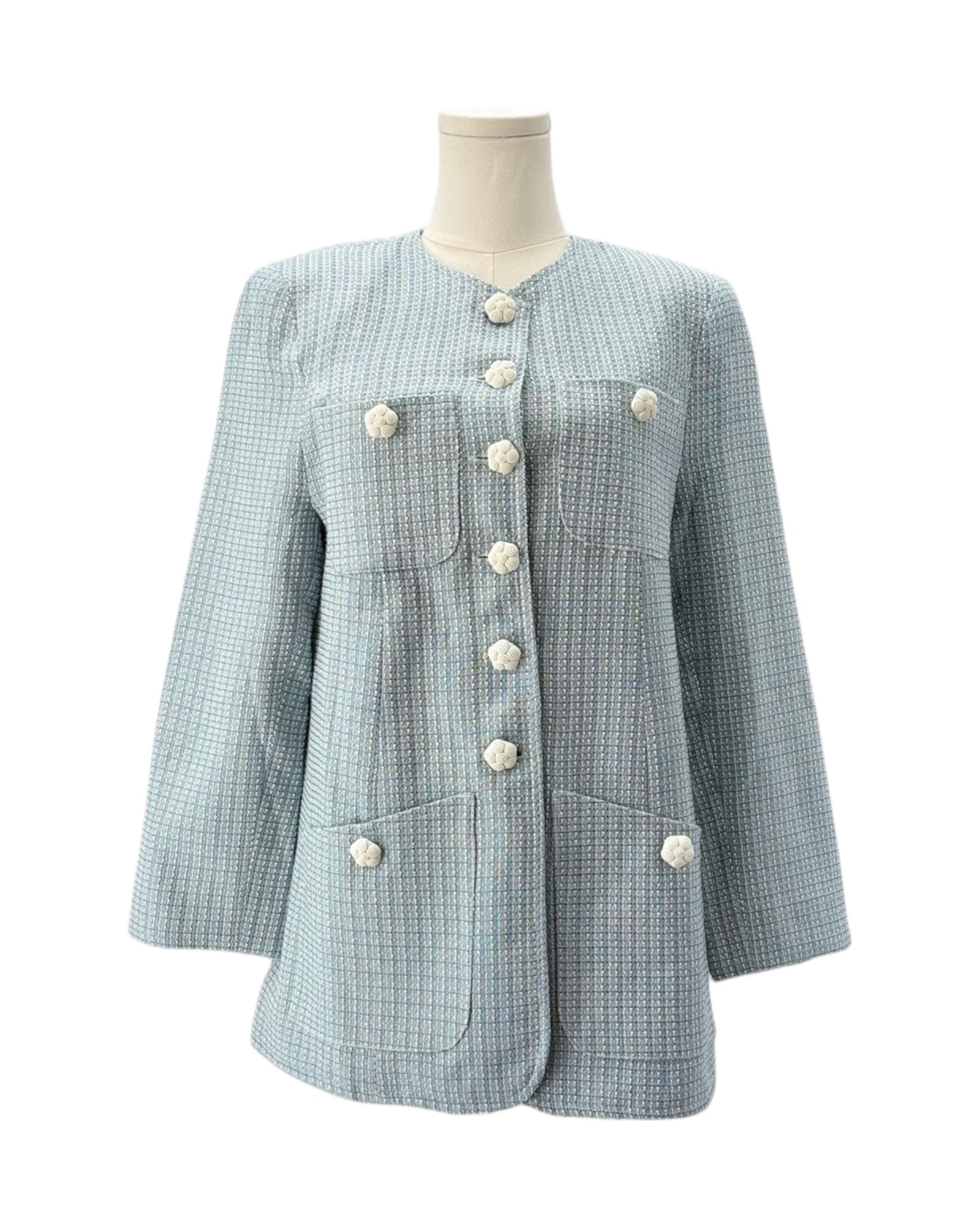 Light blue tweed jacket with white buttons on a mannequin against a white background