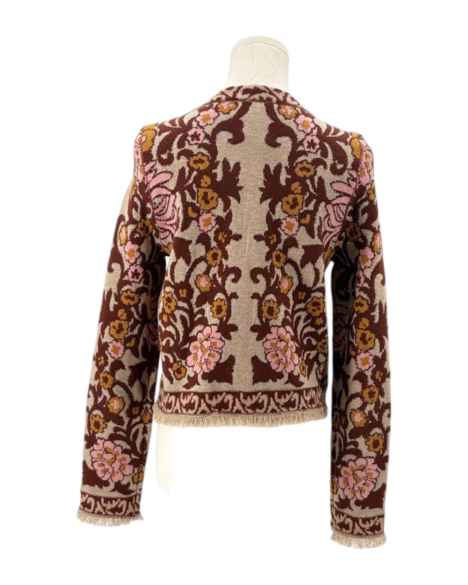 Floral patterned cardigan on a mannequin against a white background