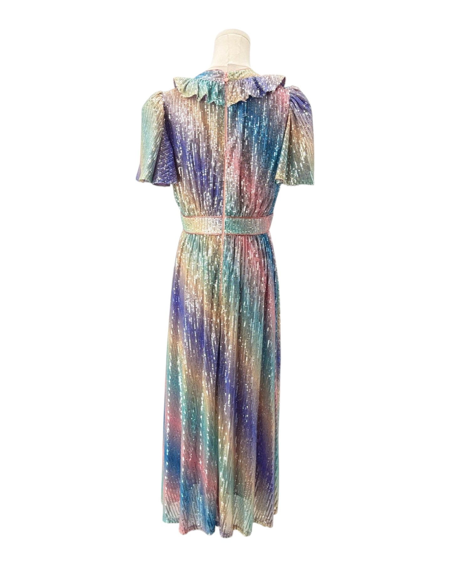 Multicolored dress on a mannequin against a white background