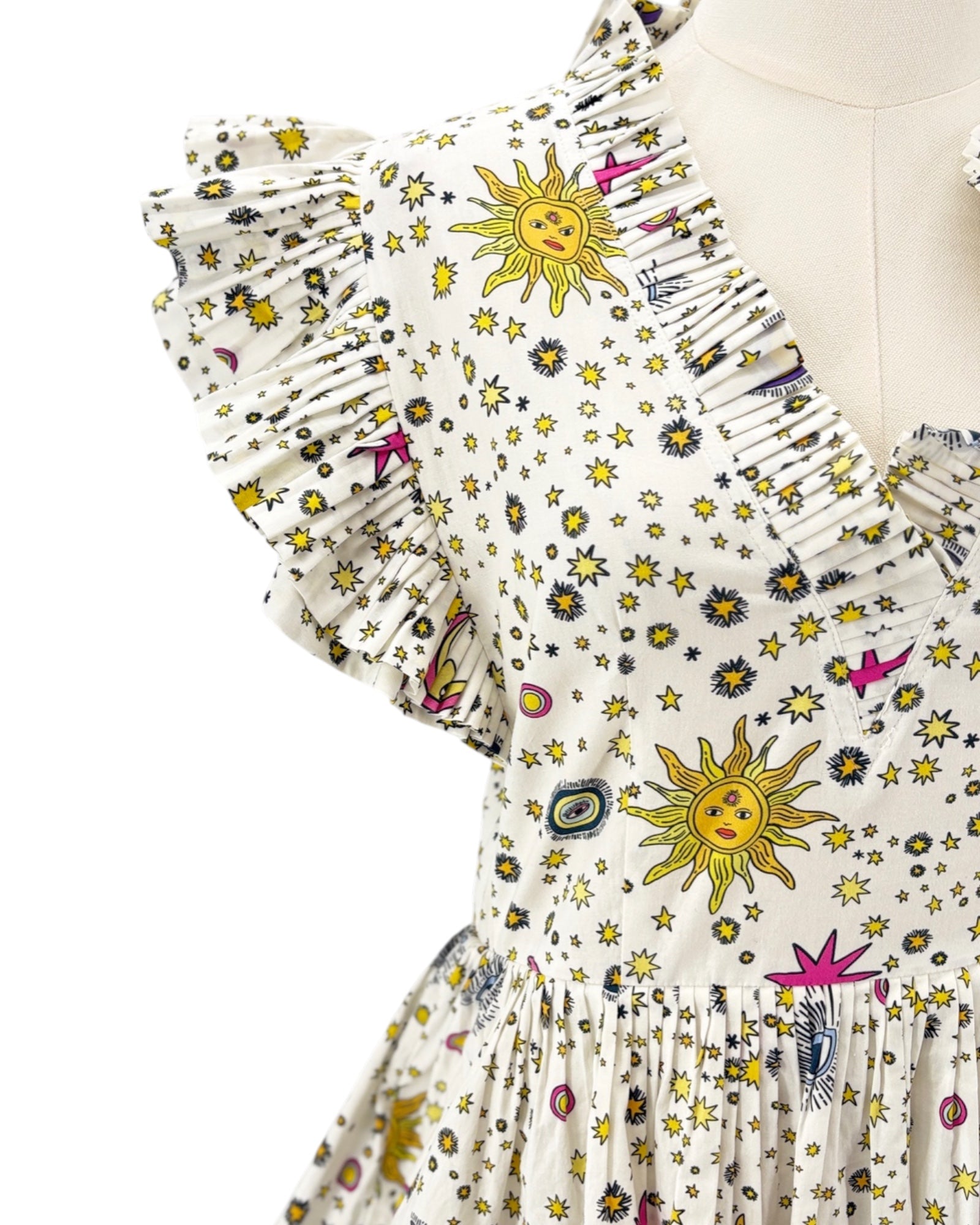 Celia B Sun and stars white dress on a mannequin against a white background