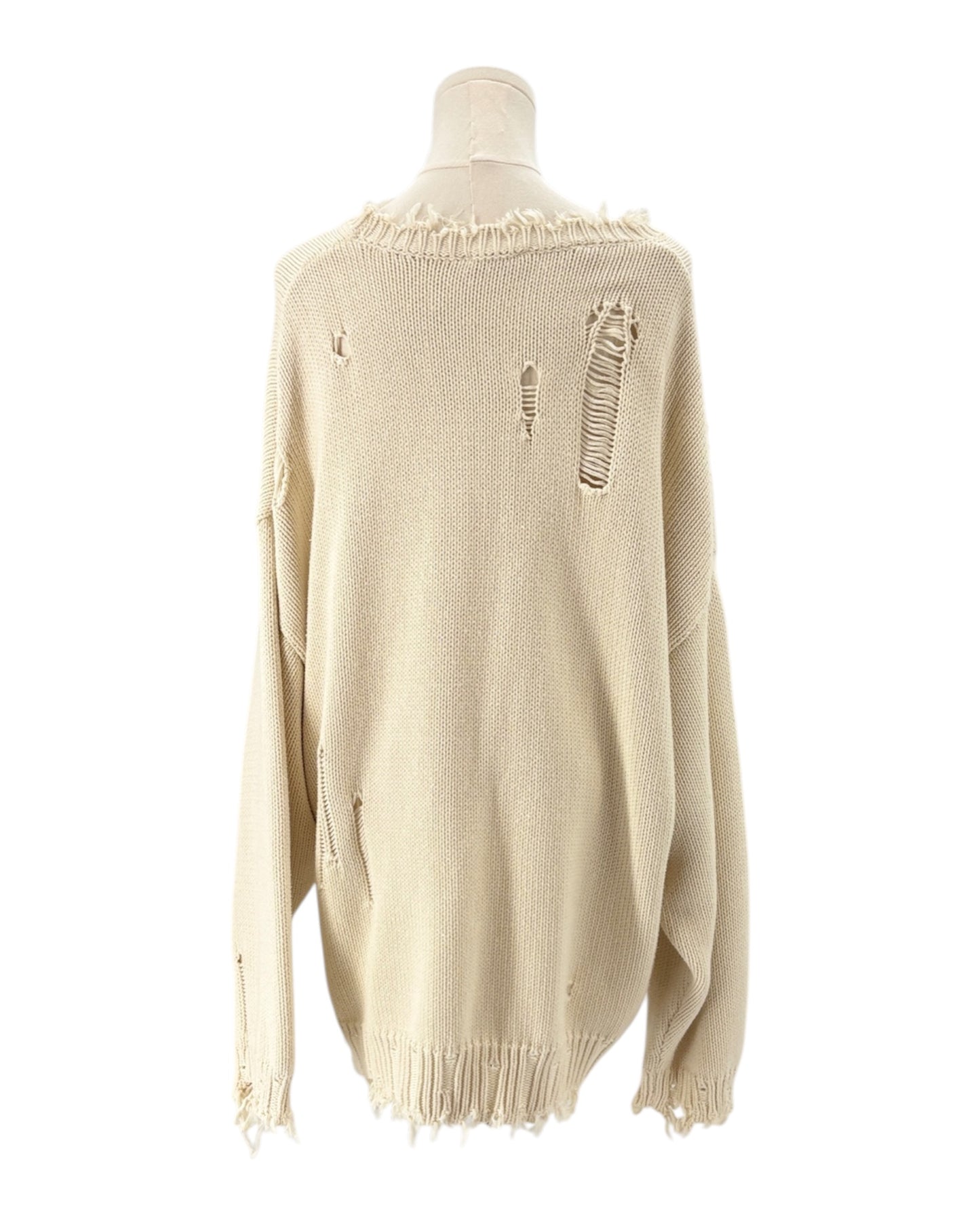 Denimist beige sweater with an American flag design on a mannequin against a background