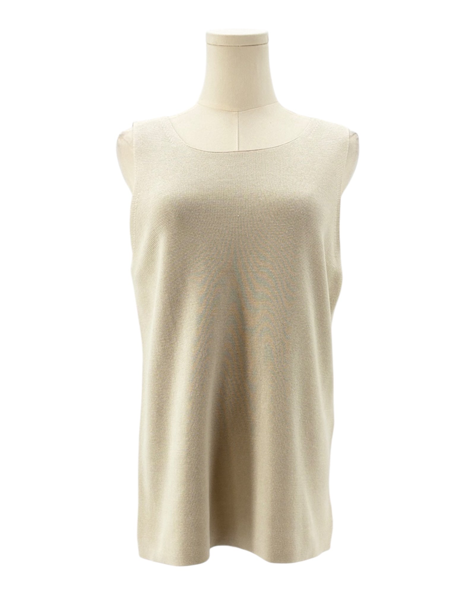 Beige sleeveless top on a mannequin against a white background