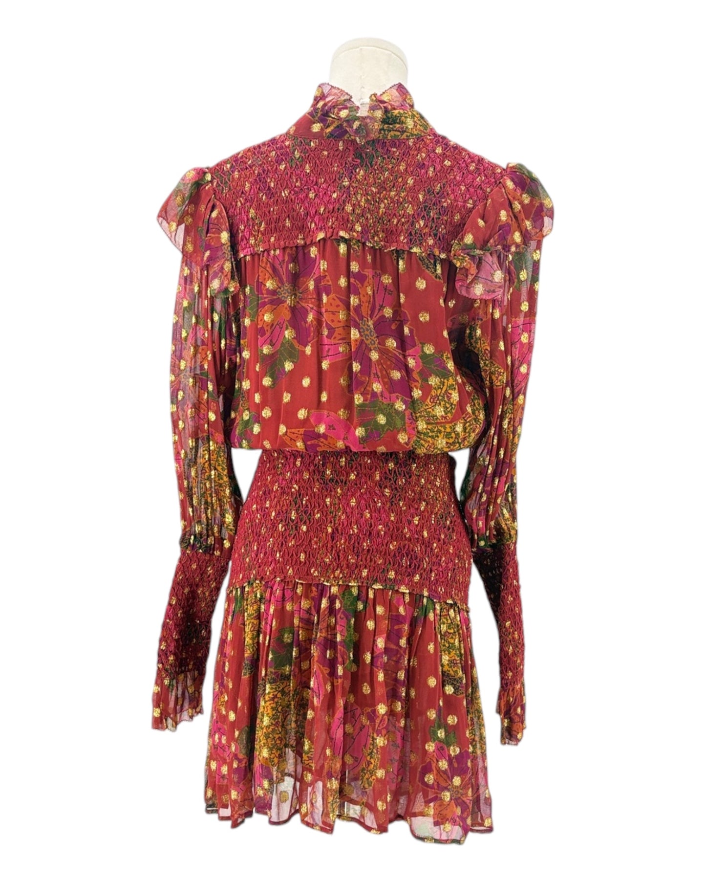 Colorful patterned dress on a mannequin against a white background