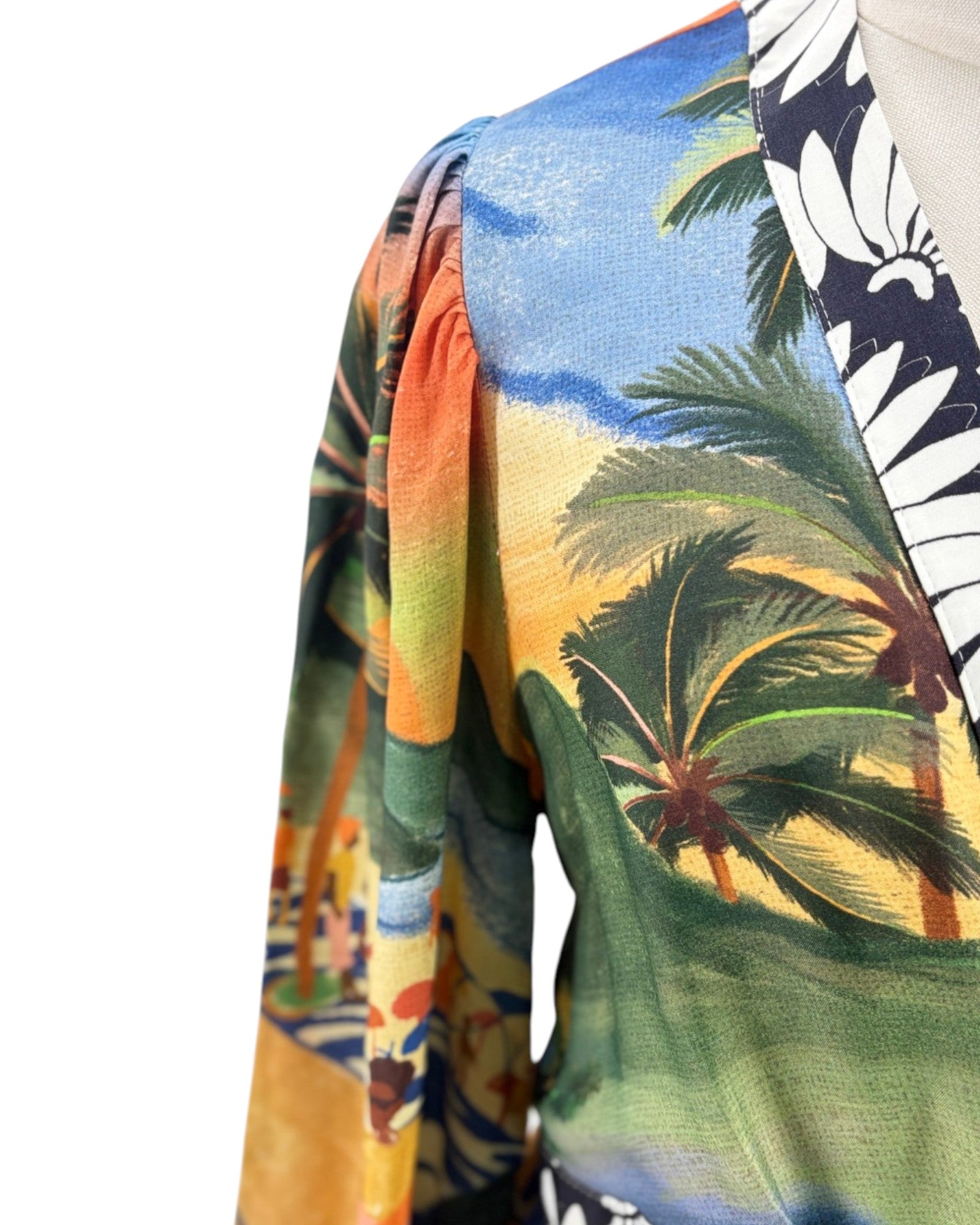 Colorful dress with tropical palm tree design on a white background