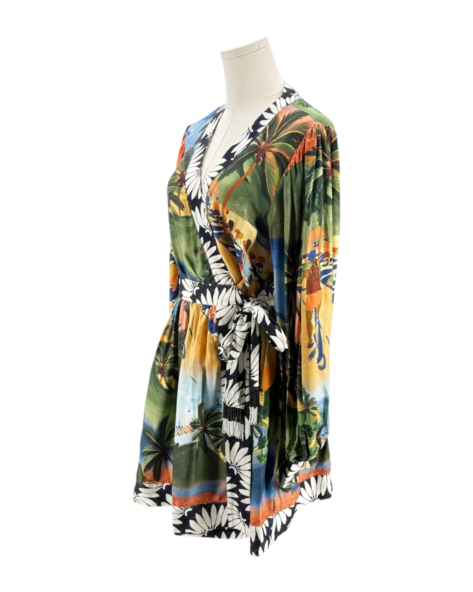 Colorful floral dress on a mannequin against a white background