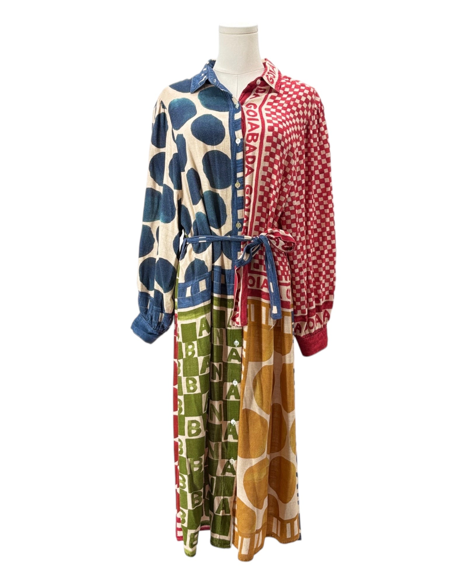 Mannequin wearing a colorful patterned dress with a white background