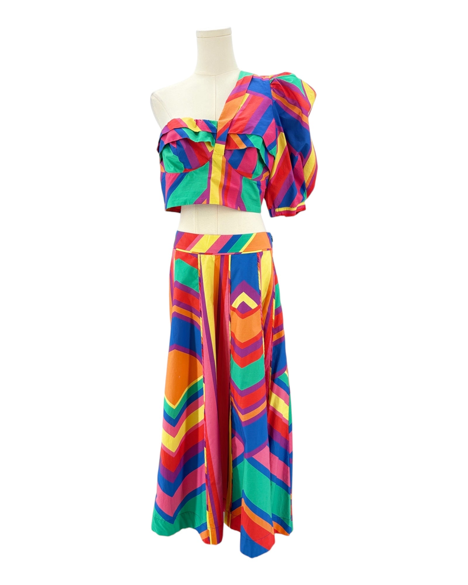 Colorful striped skirt and top on a mannequin against a white background