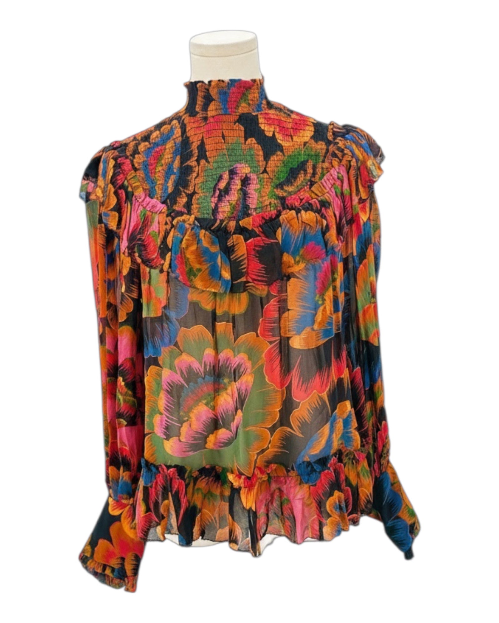 Colorful floral blouse on a mannequin against a white background