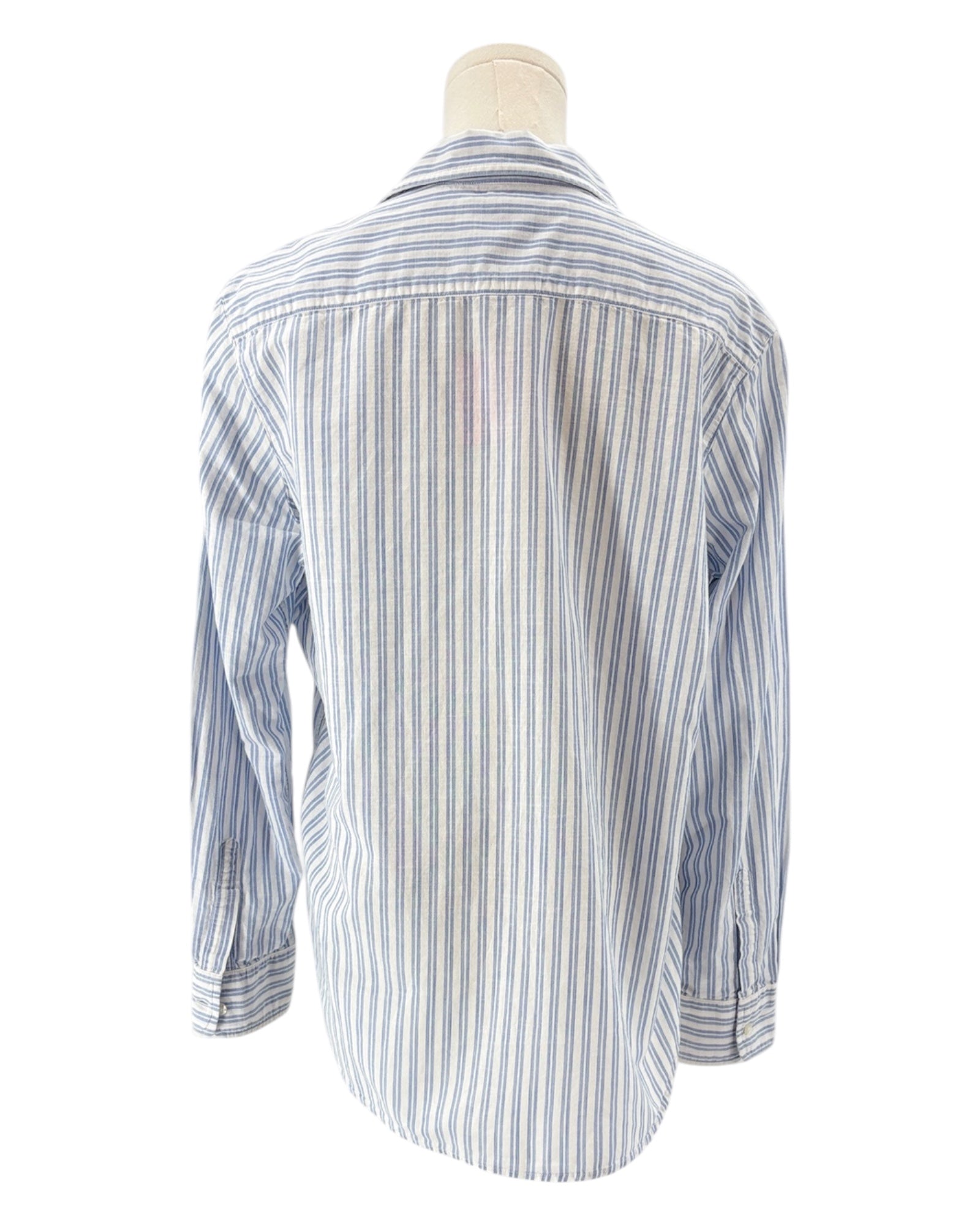 Striped shirt on a mannequin against a white background