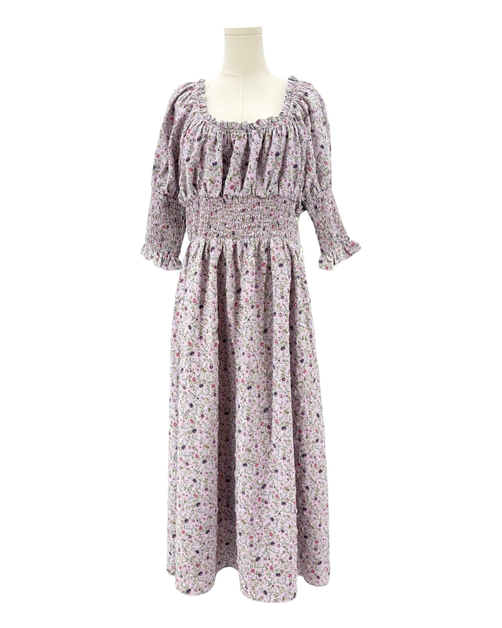 Hyacinth House floral dress on a mannequin against a white background