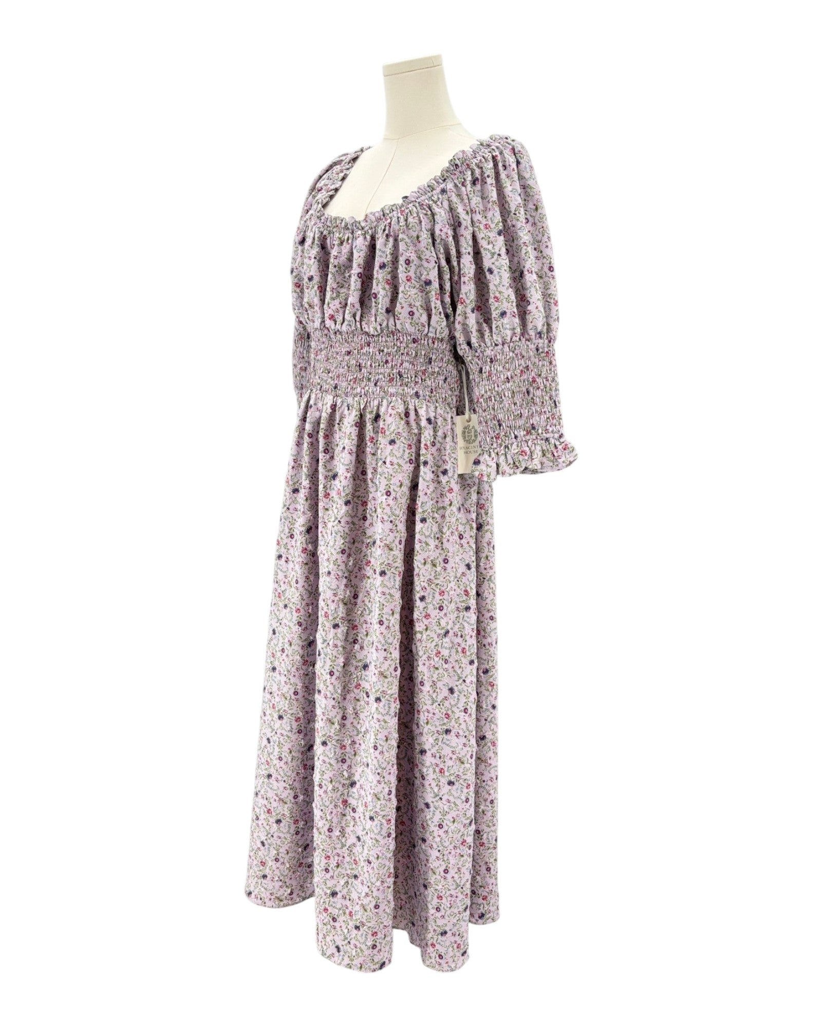 Hyacinth House floral dress on a mannequin against a white background