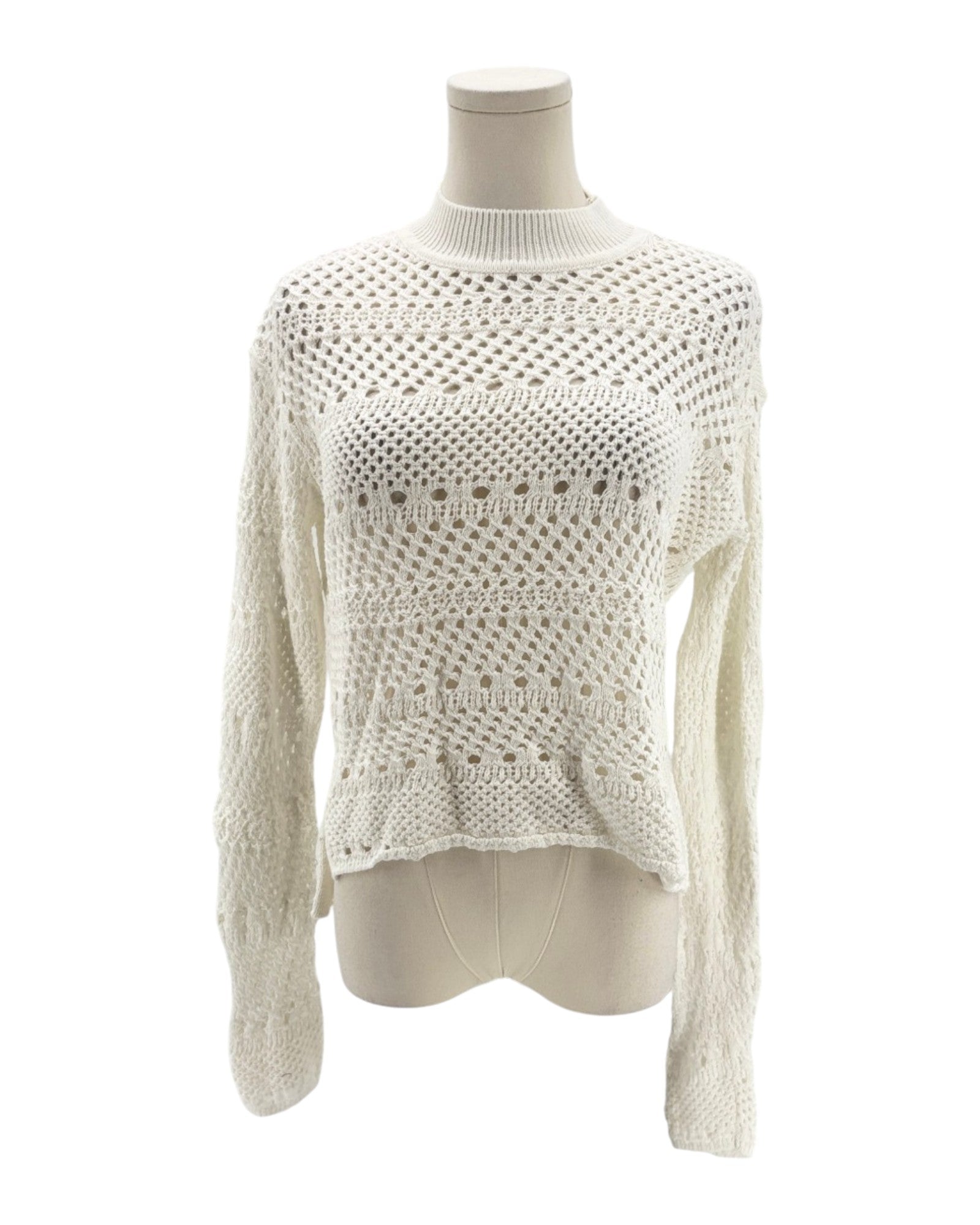 White knitted sweater on a mannequin against a white background