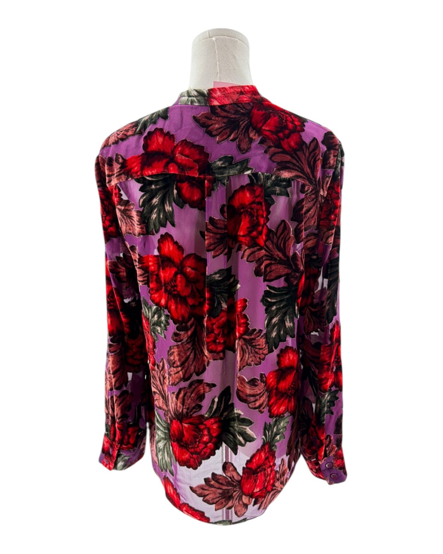 Floral patterned shirt on a mannequin against a white background
