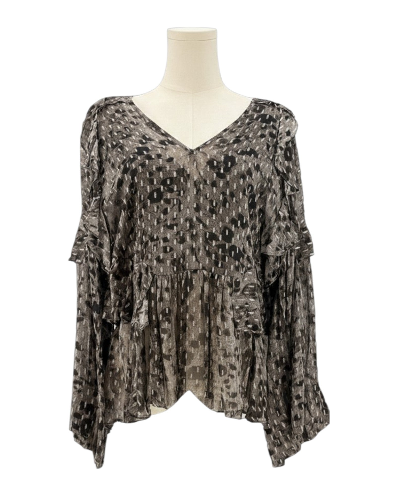 IRO sheer patterned blouse on a mannequin against a white background