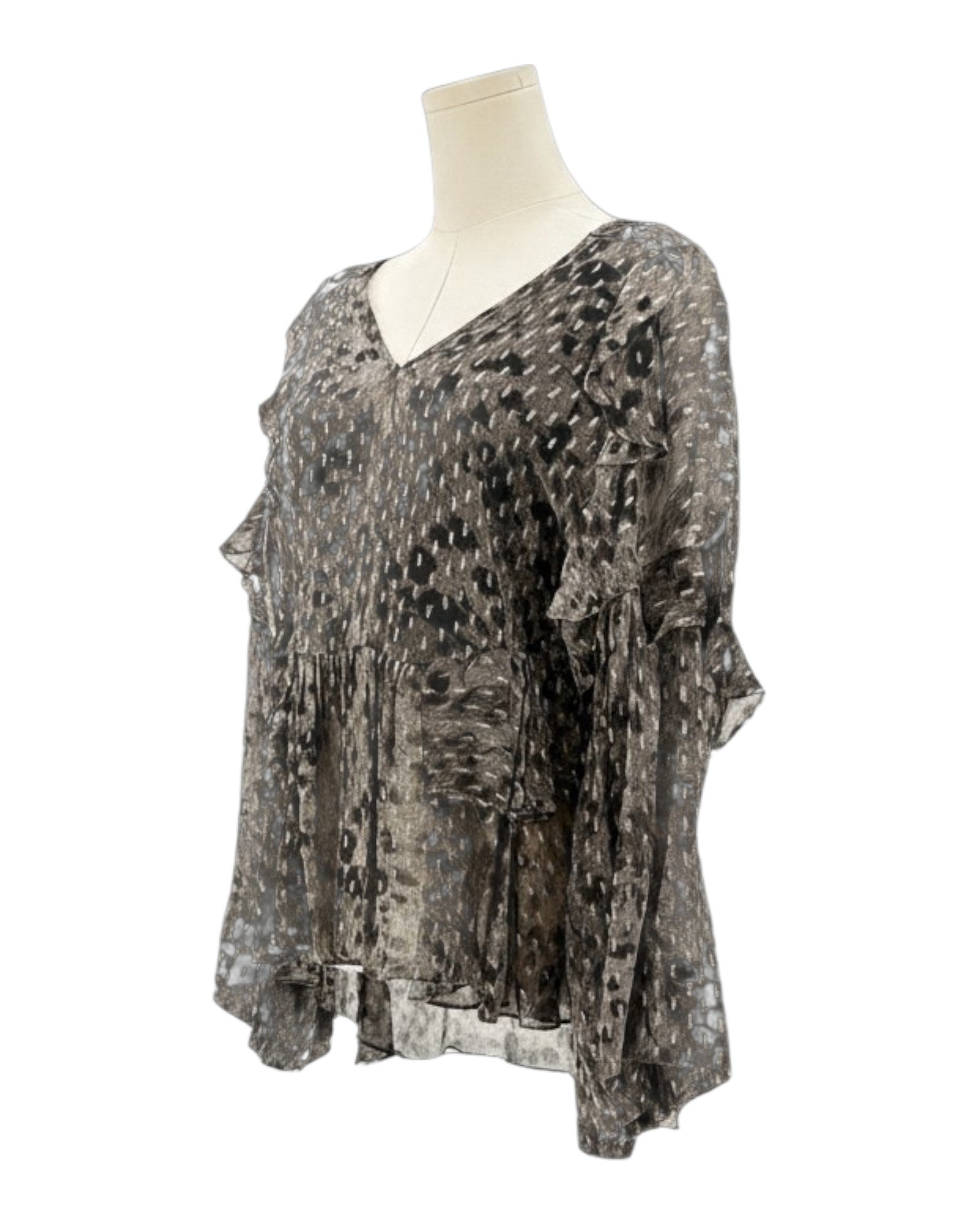 IRO sheer patterned blouse on a mannequin against a white background