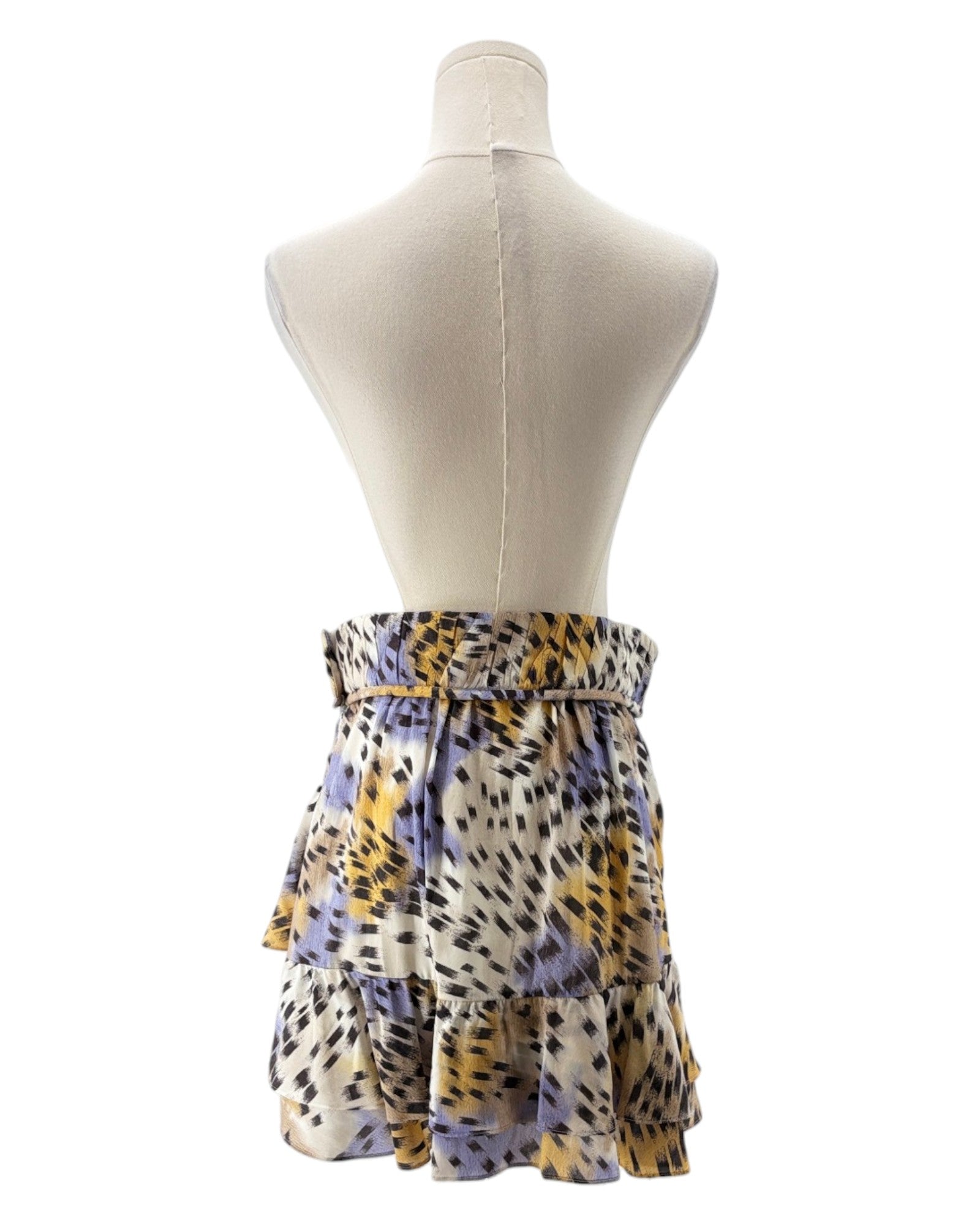 Skirt with a leopard print pattern on a mannequin against a white background