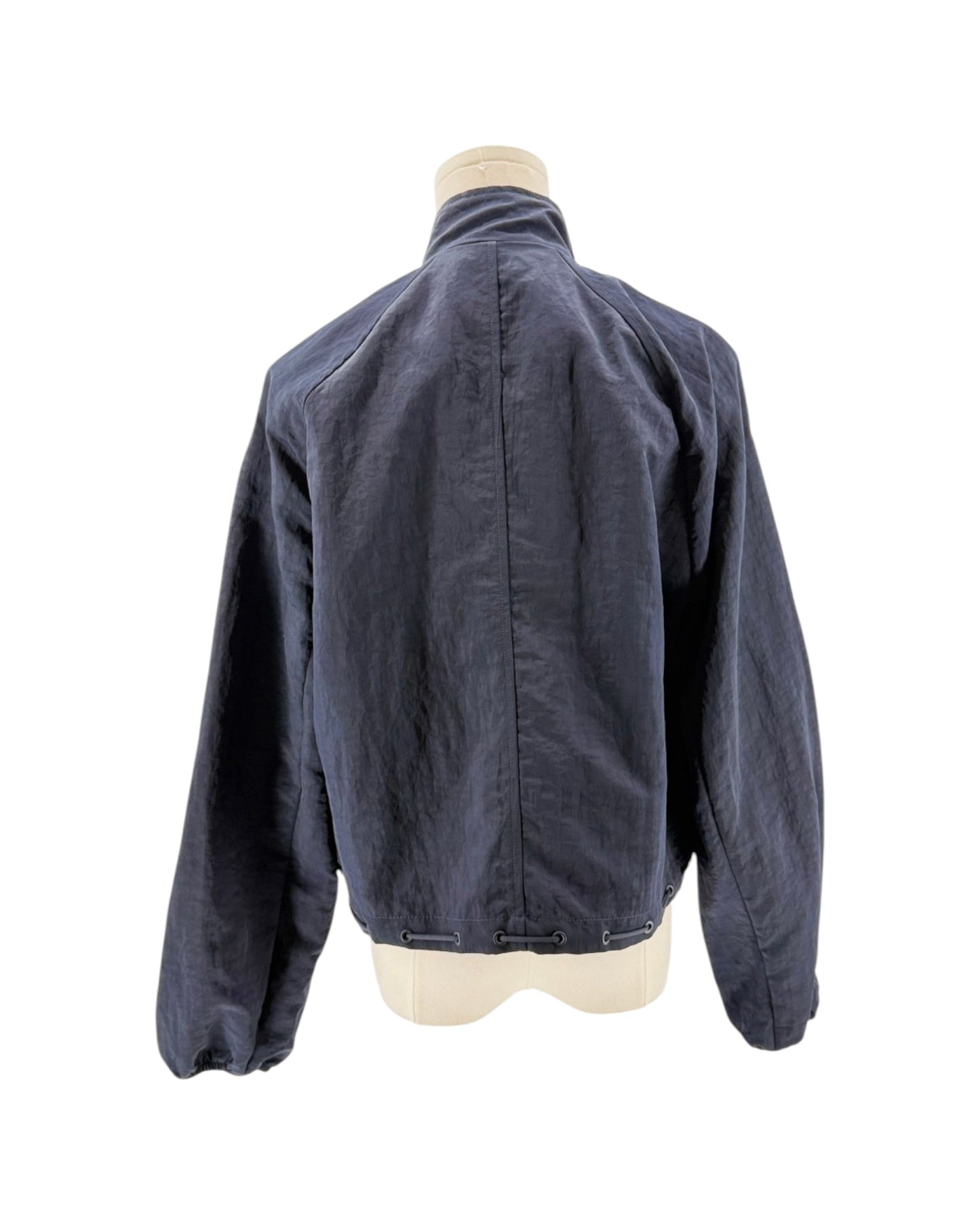Blue jacket on a mannequin against a white background