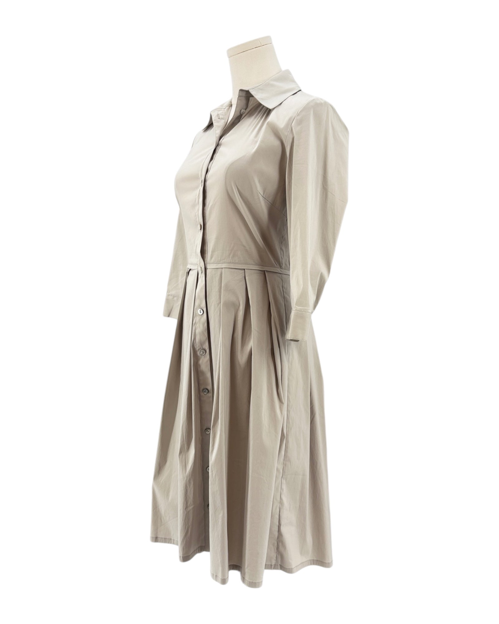 Beige long sleeve dress on a mannequin against a white background