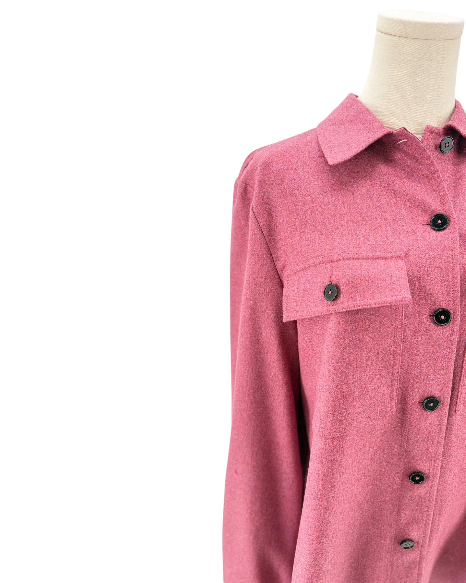 Pink shirt on a mannequin against a white background