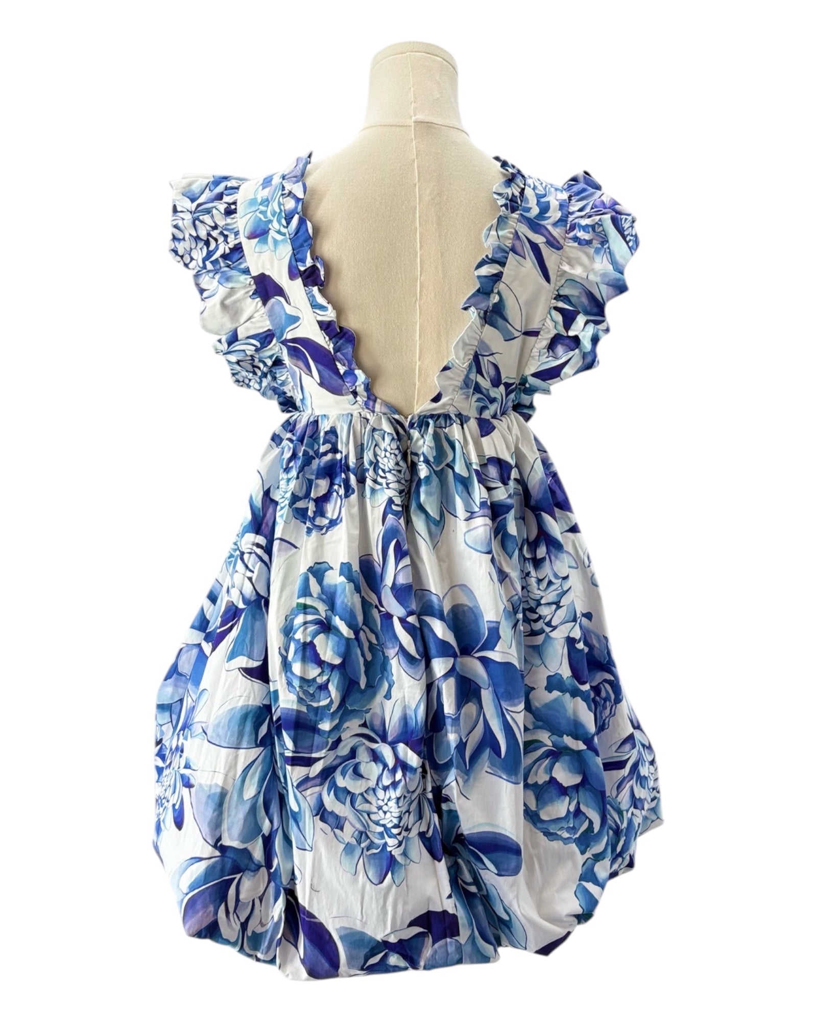Blue and white floral dress on a mannequin against a white background