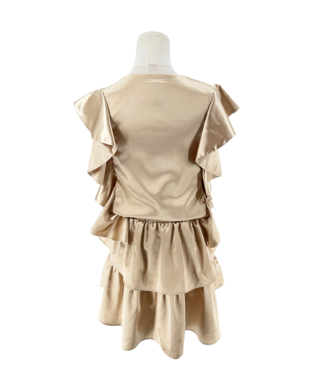 A beige satin-like dress displayed on a mannequin from the back, featuring layered ruffles and a tiered skirt against a plain white background.