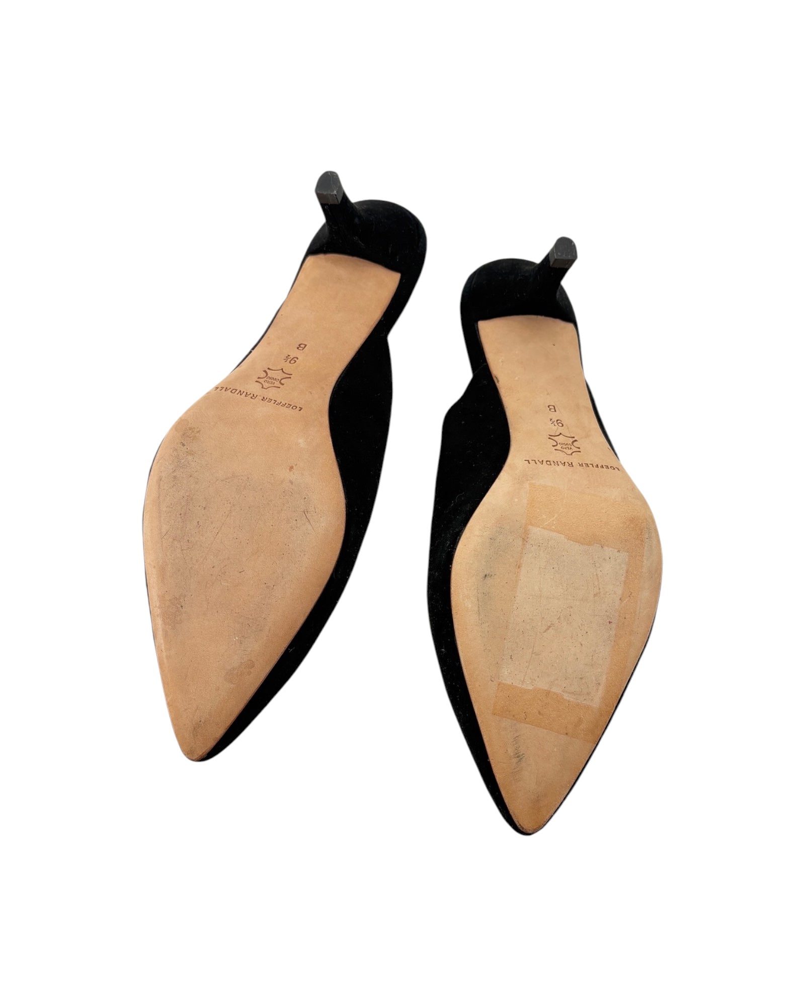 Pair of black shoe trees with tan soles on a white background