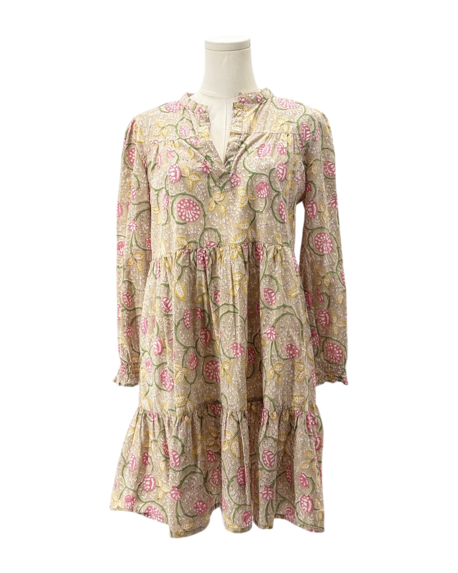 Floral patterned dress on a mannequin against a white background