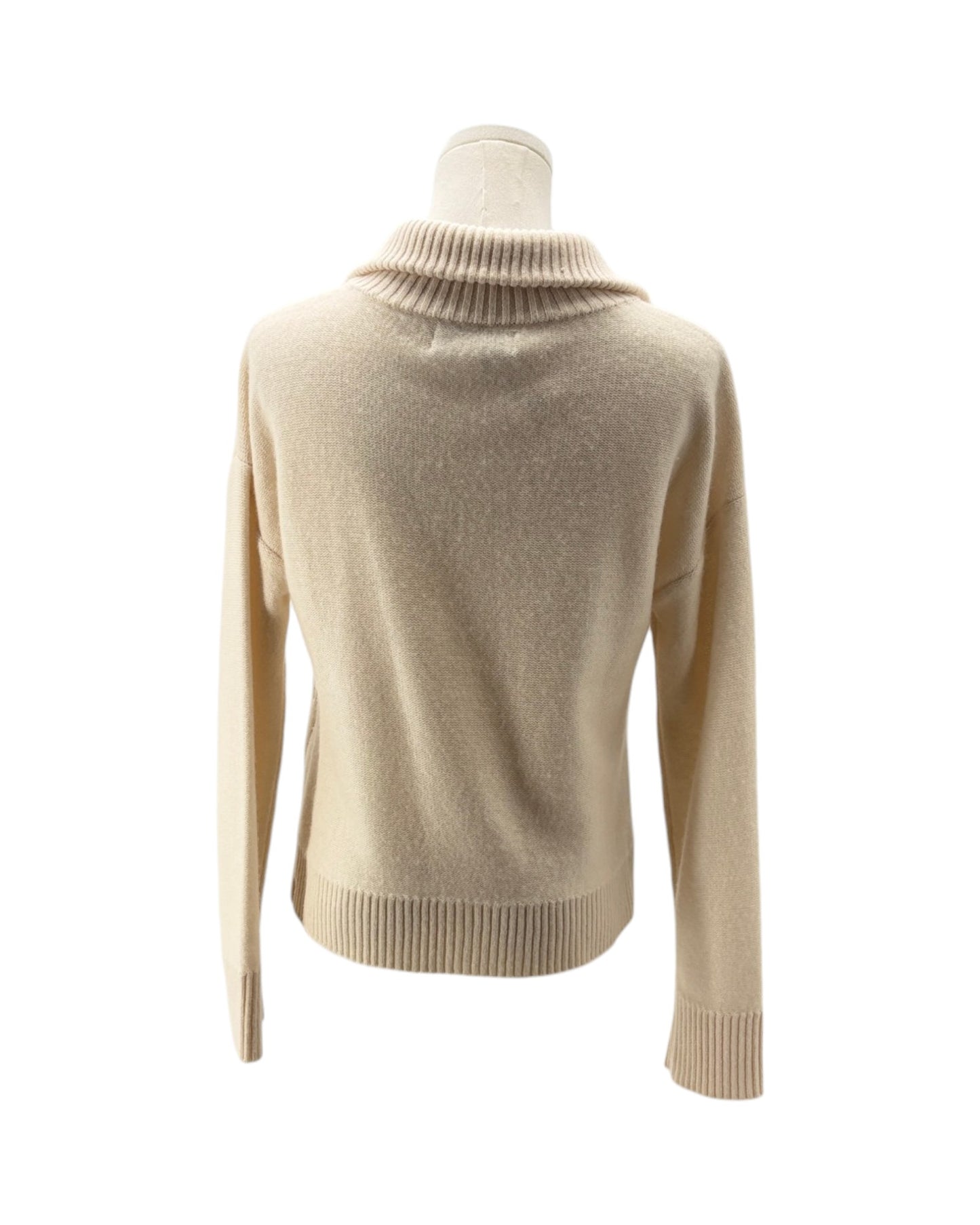 A beige knit sweater with a ribbed mock neck, long sleeves, and a ribbed hem and cuffs, displayed on a mannequin torso against a white background.