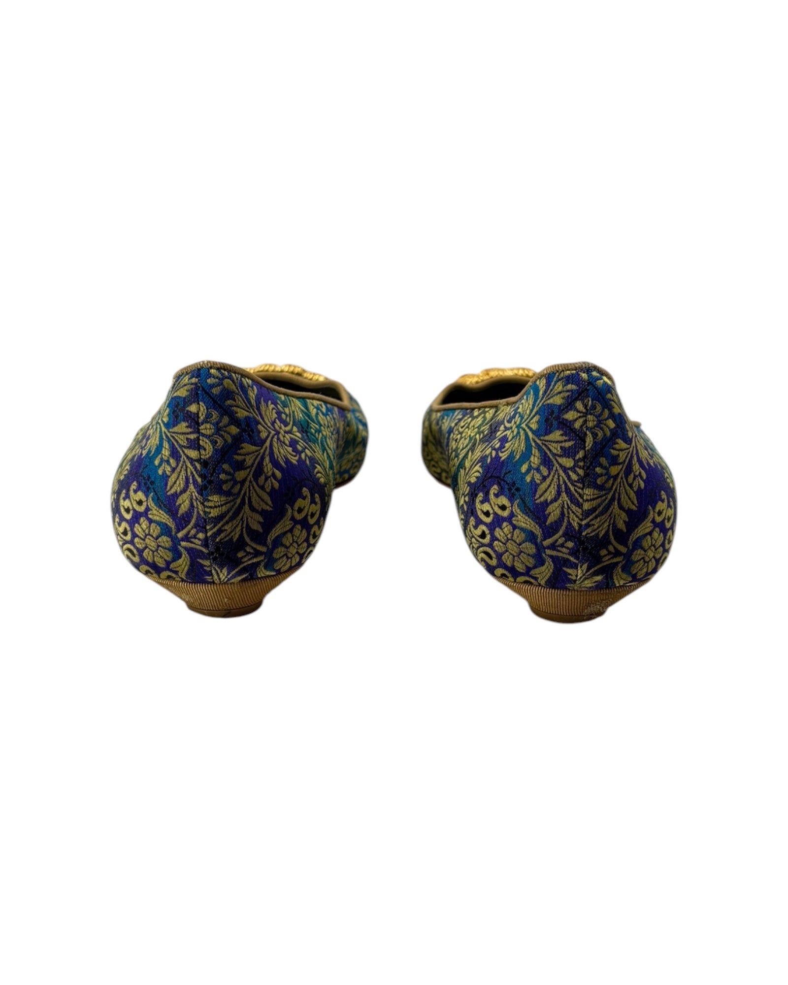 Pair of blue and gold patterned shoes on a white background