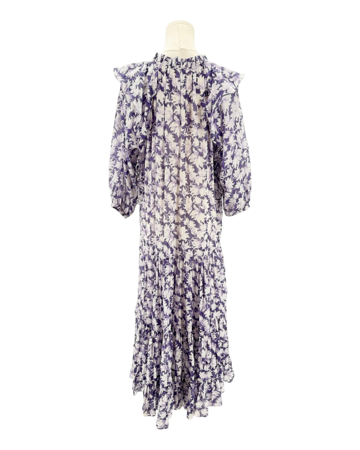 Floral dress on a mannequin against a white background