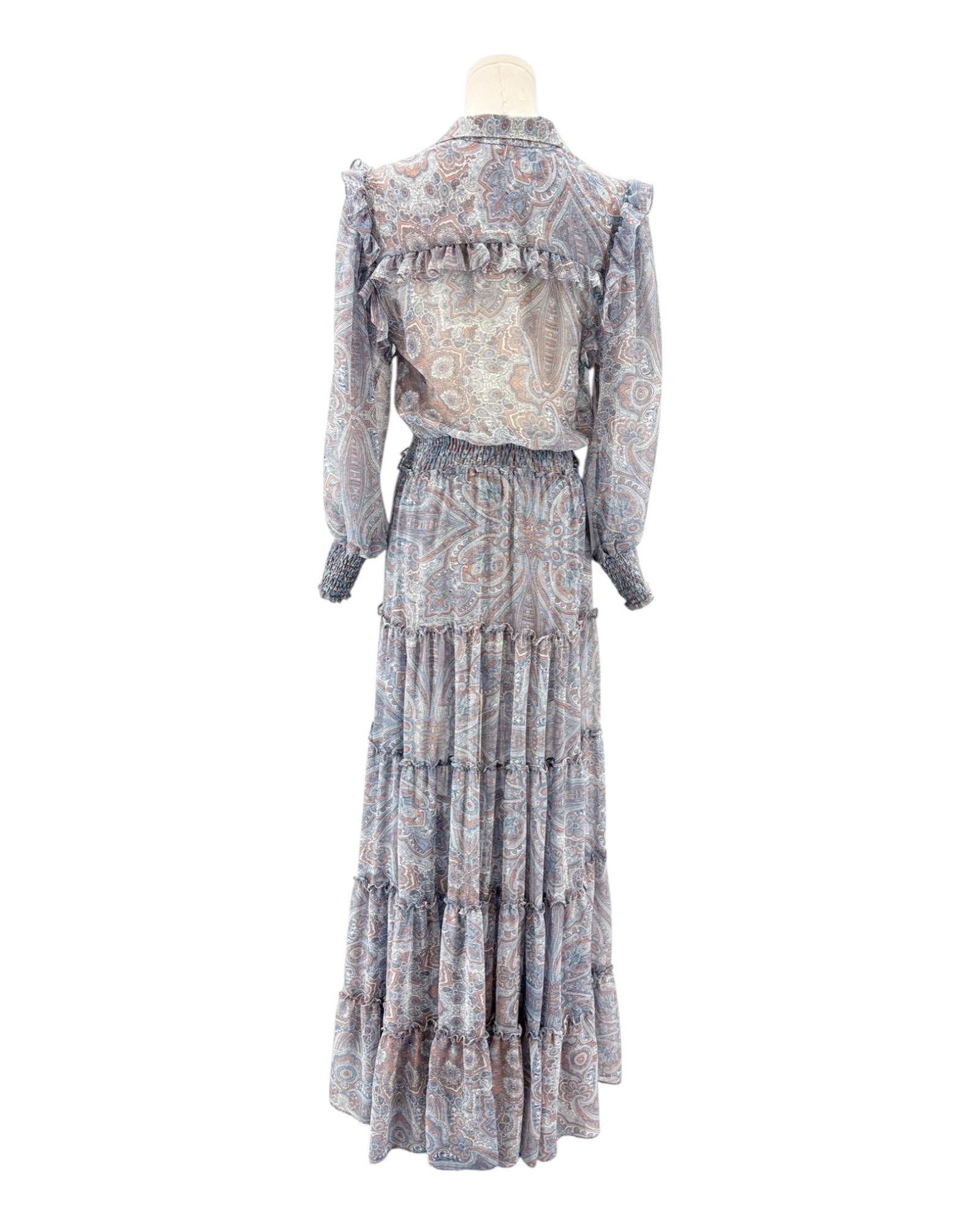 Floral patterned dress on a mannequin against a white background