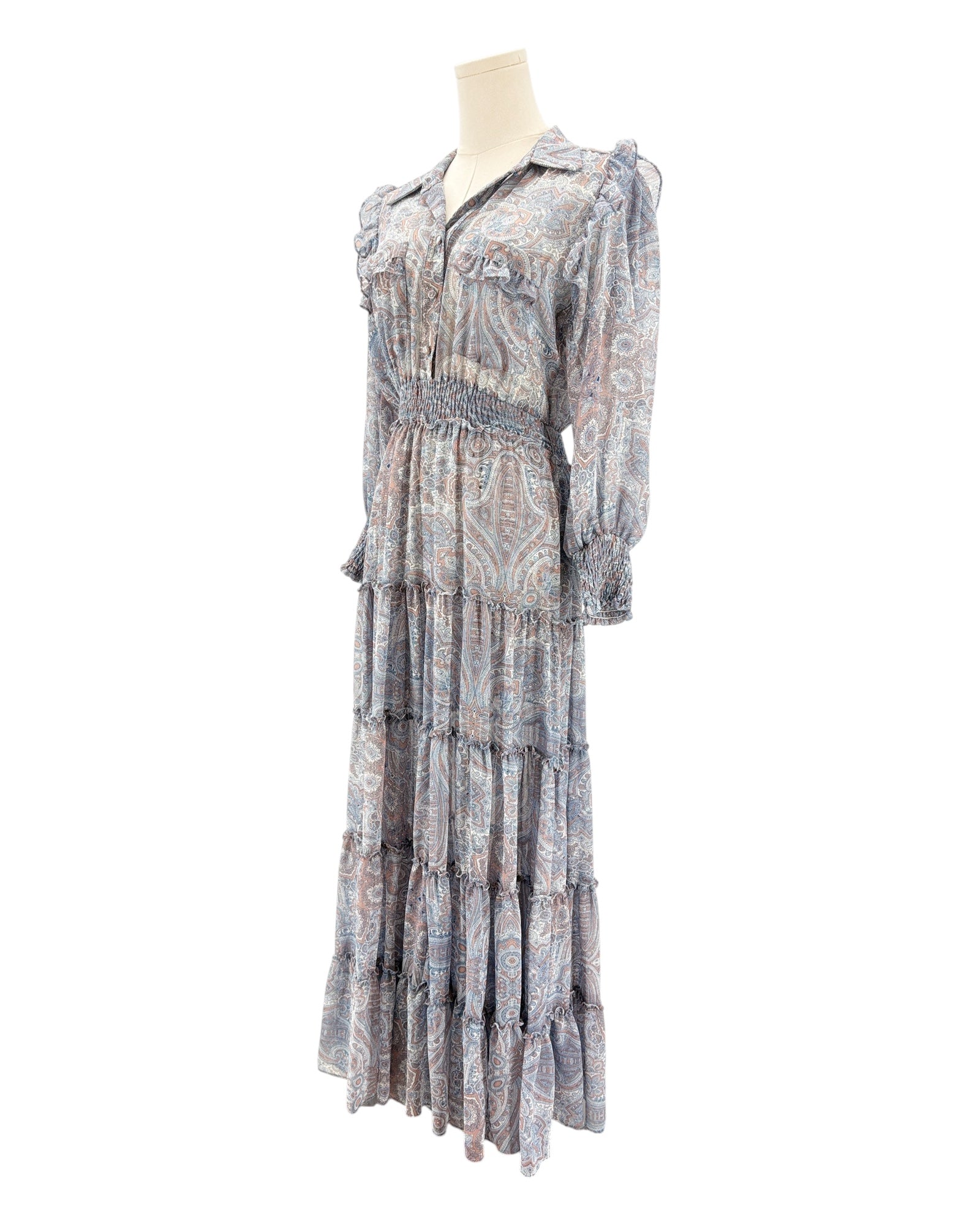 Patterned dress on a mannequin against a white background