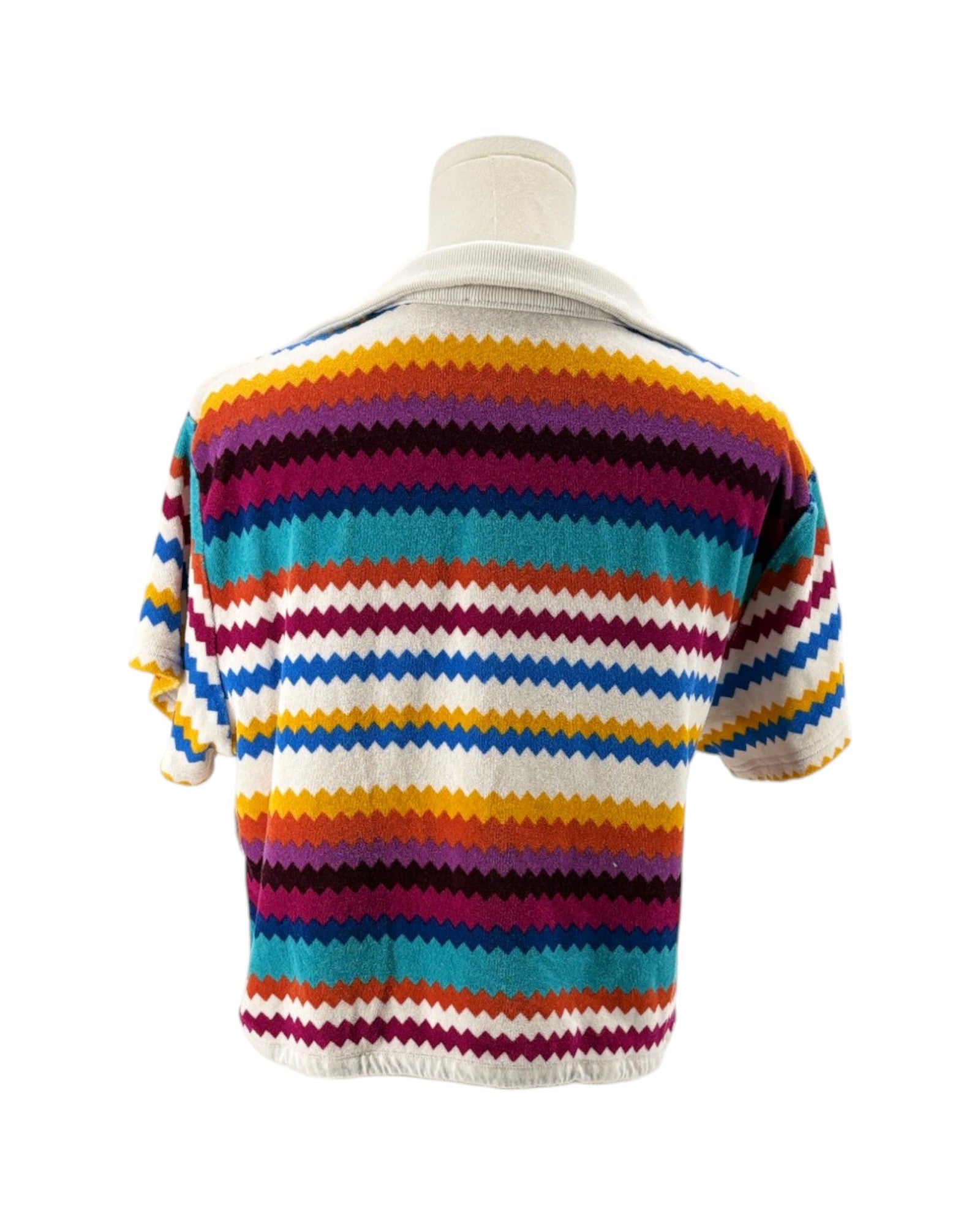 Colorful striped sweater on a mannequin against a white background