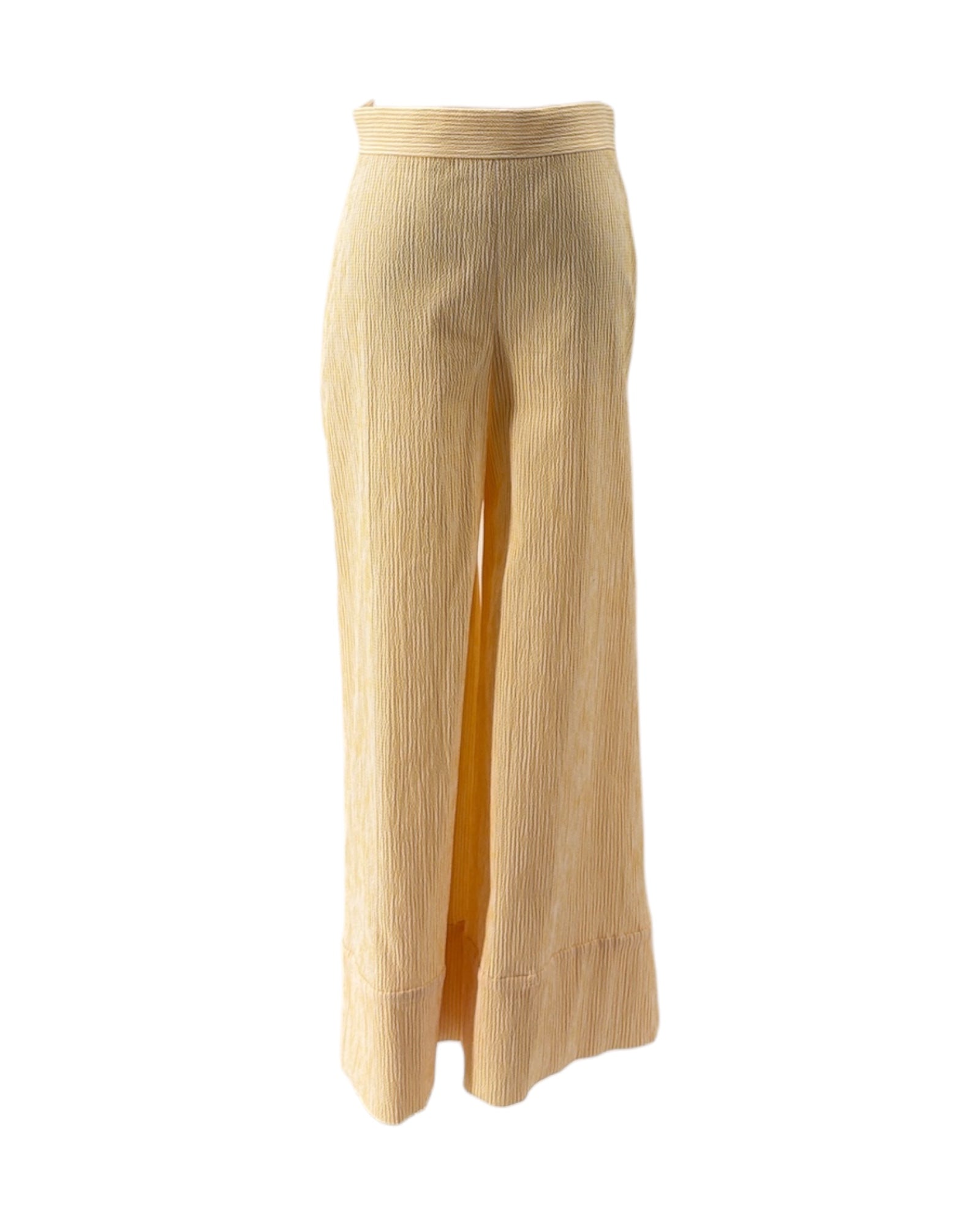 Beige and yellow ribbed pants on a white background