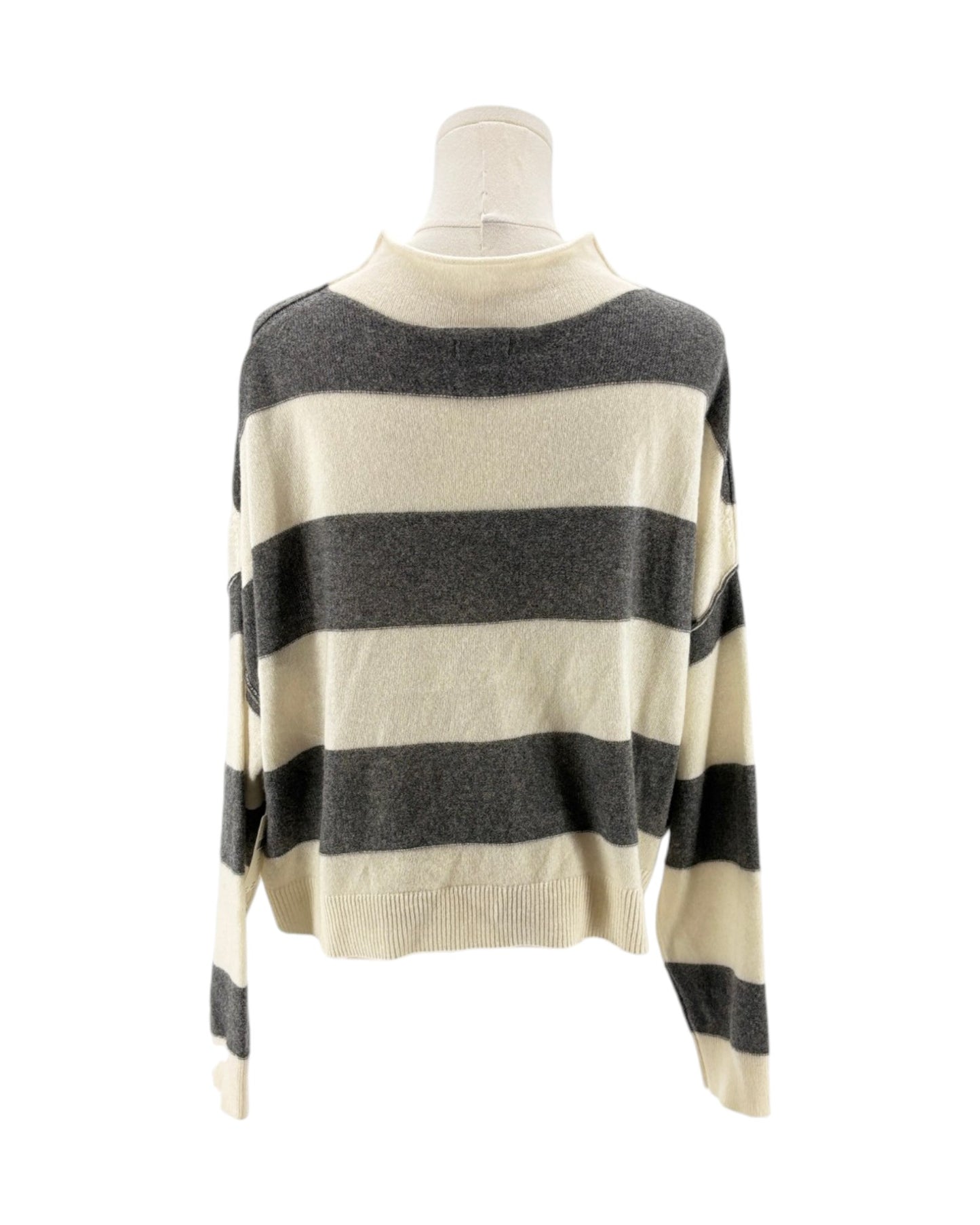 Striped sweater on a mannequin against a white background
