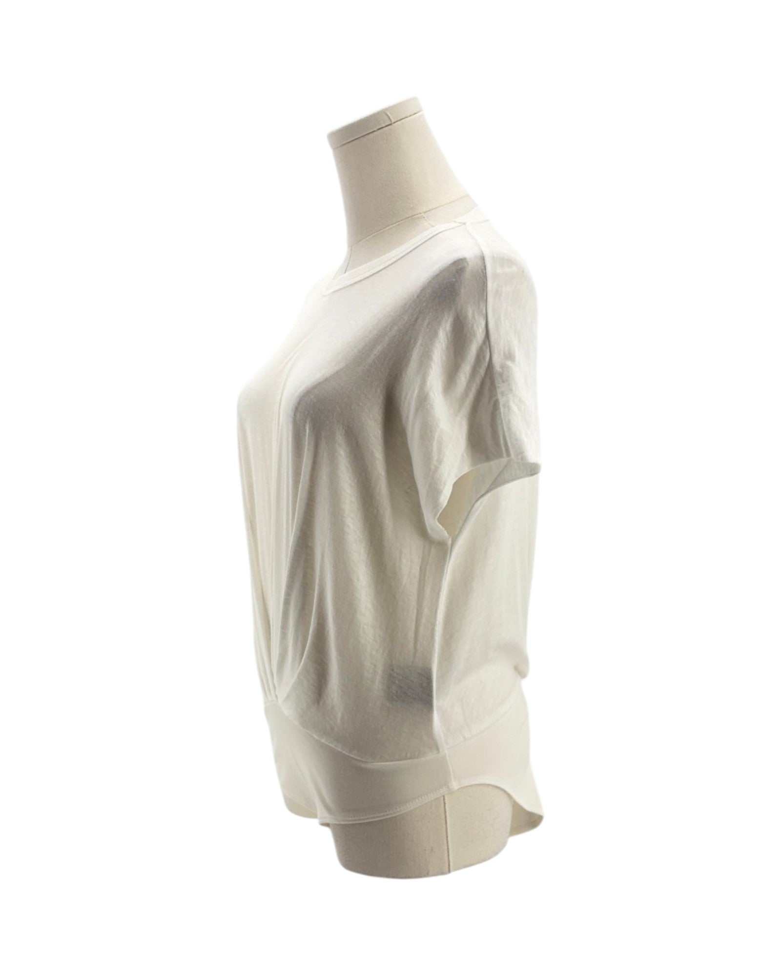 white long-sleeve top on a mannequin against a white background
