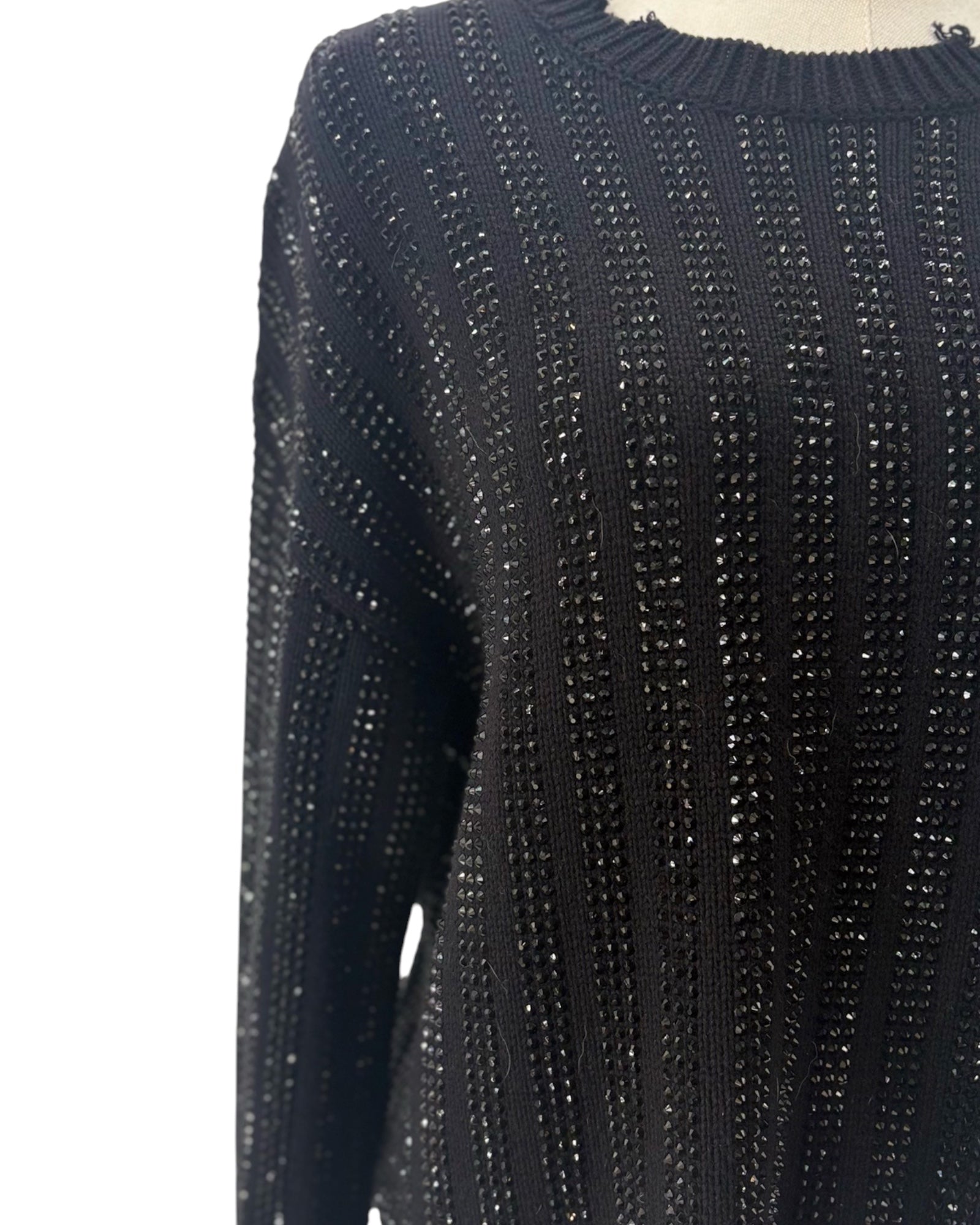 Embellished Sweater on a mannequin on white background