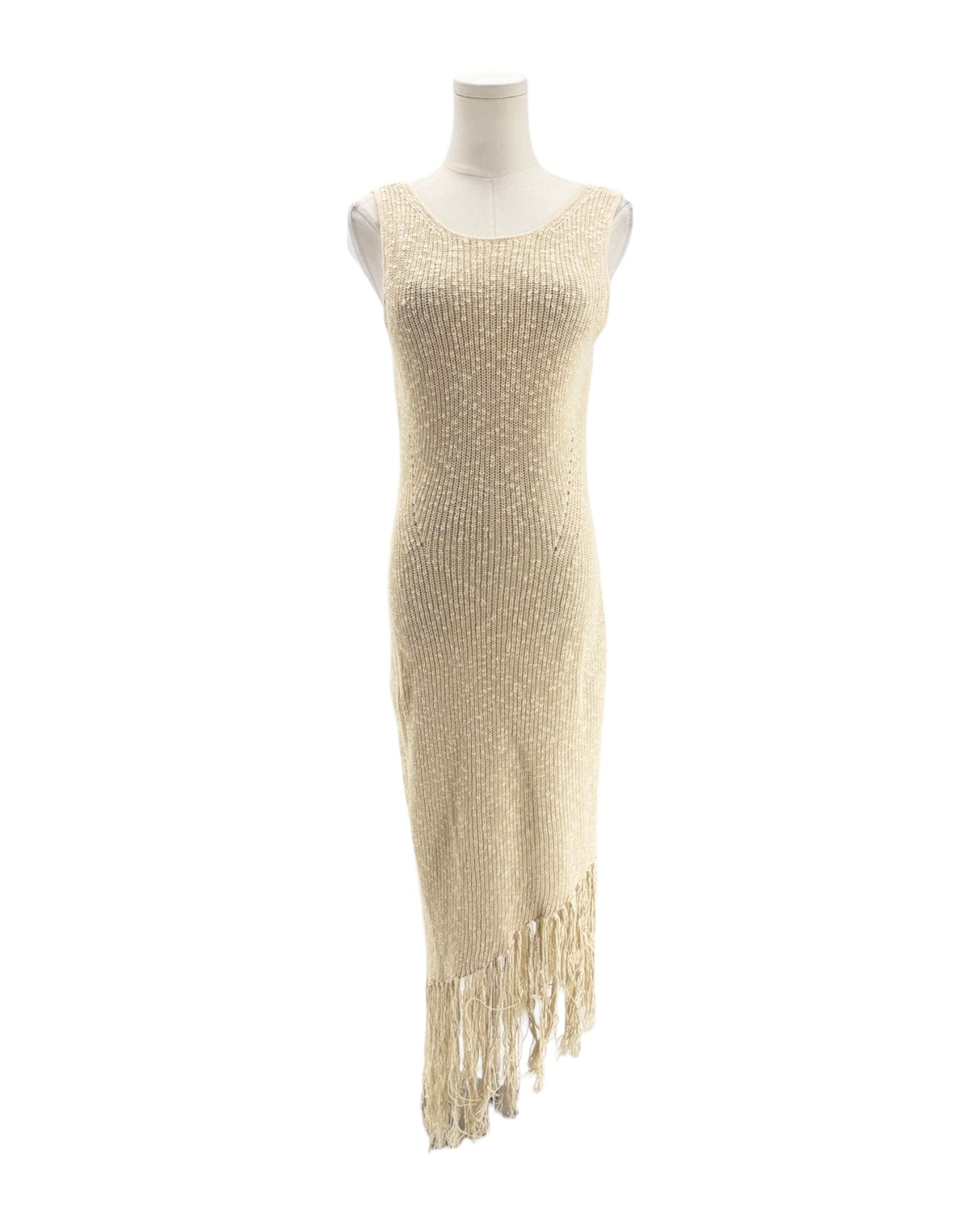 Mannequin wearing a beige beaded dress with fringe on a white background