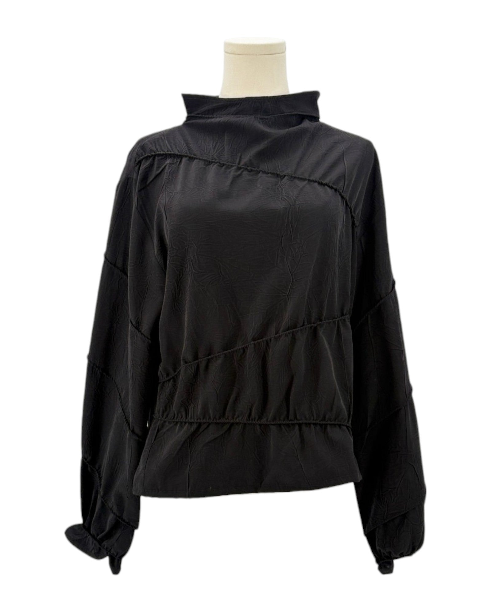 Rohe black long-sleeve shirt on a mannequin against a white background