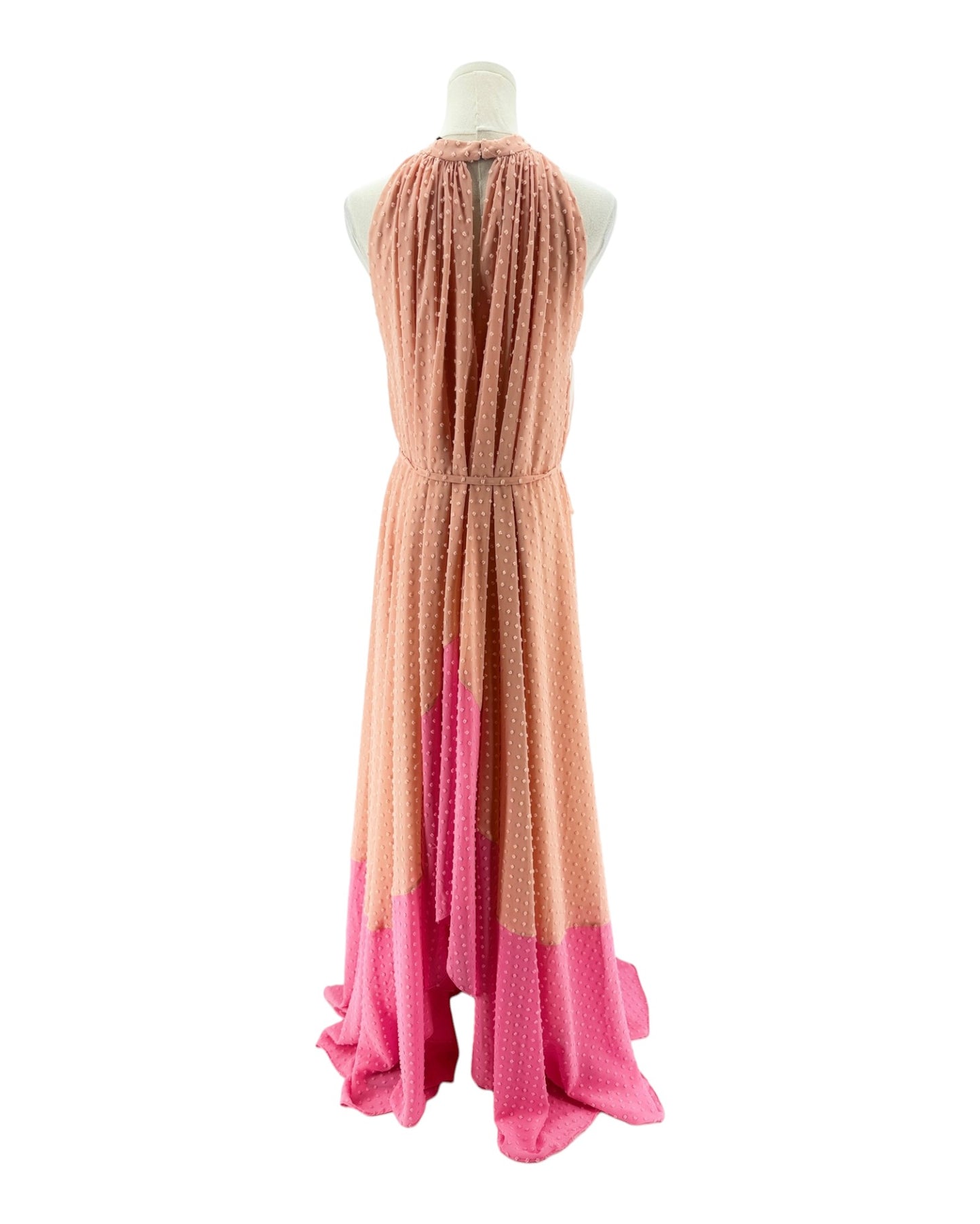 Mannequin wearing a halter neck dress with a gradient from pink to orange on a white background