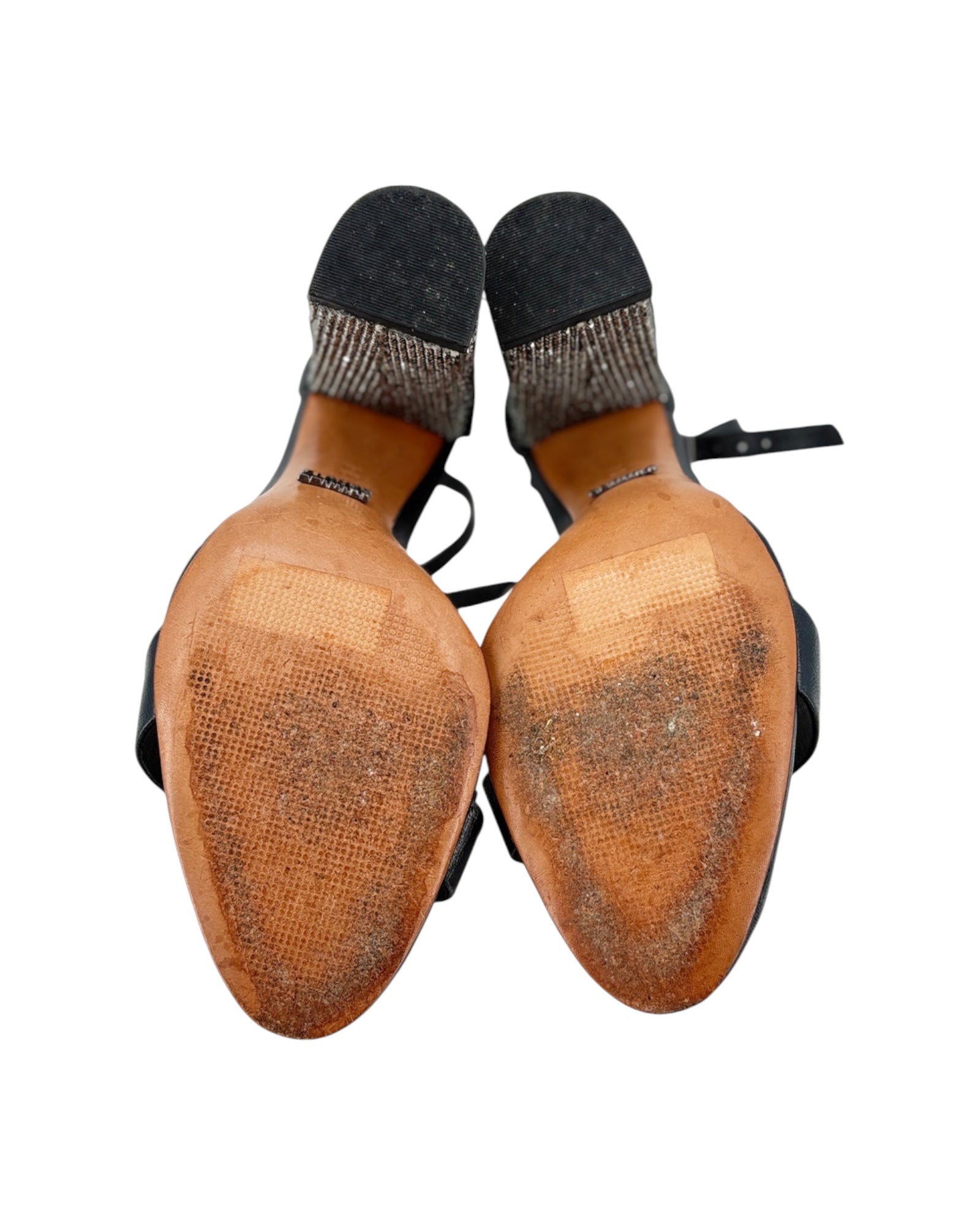 Pair of shoes with black soles on a white background