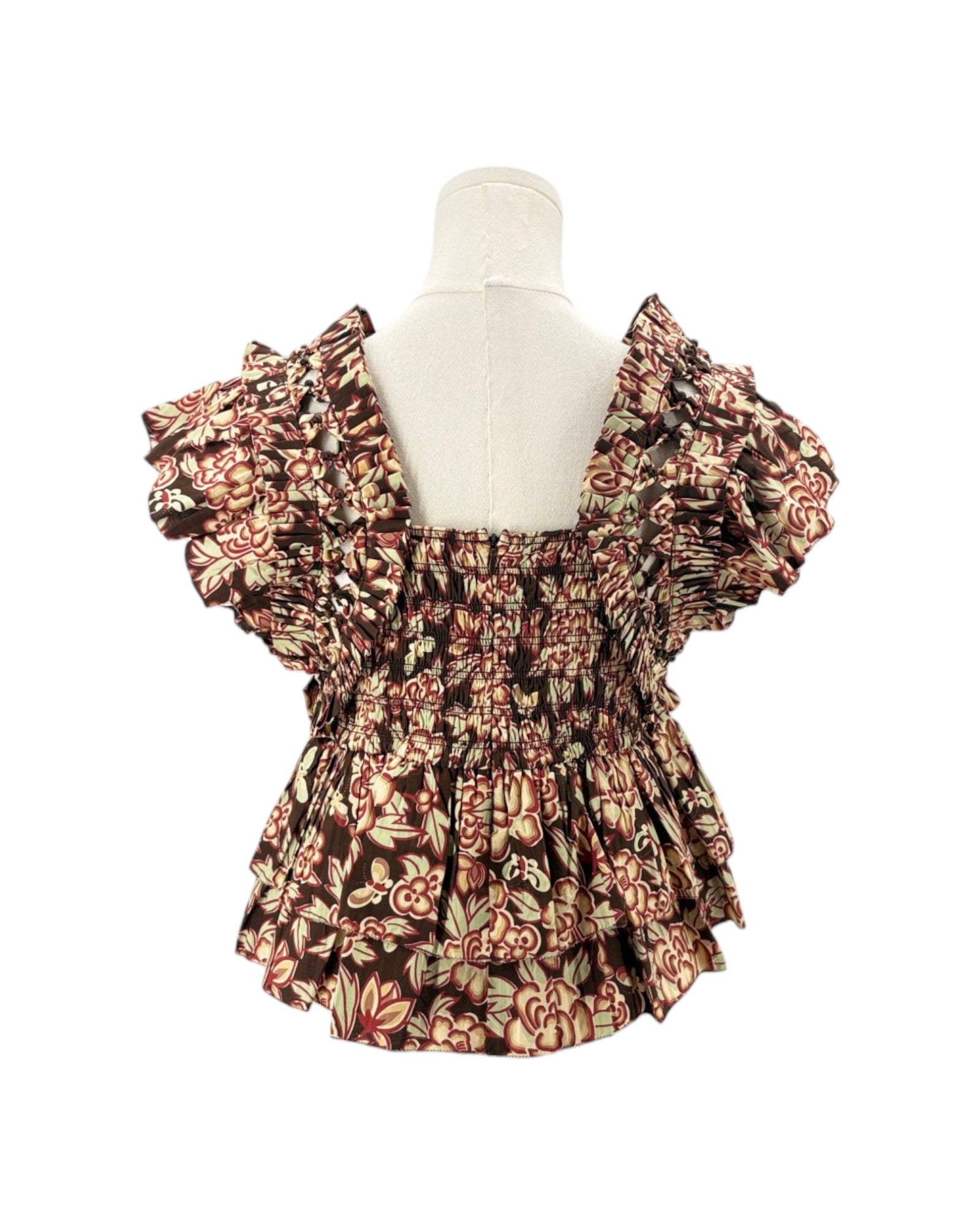 Floral patterned fabric with ruffled details on a white background