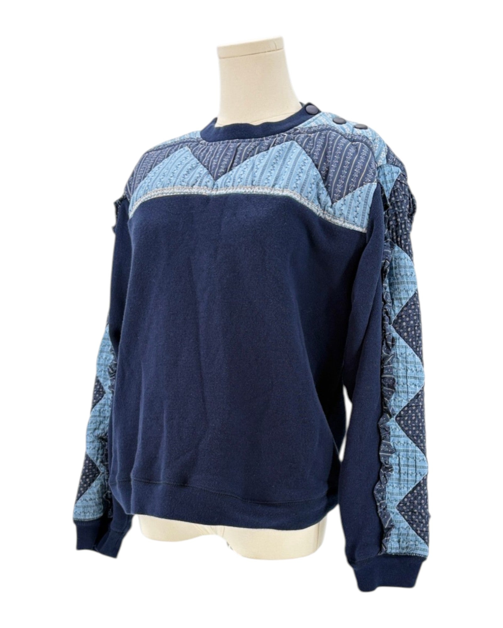 Sea NY navy blue sweater with a patchwork pattern on a mannequin against a white background